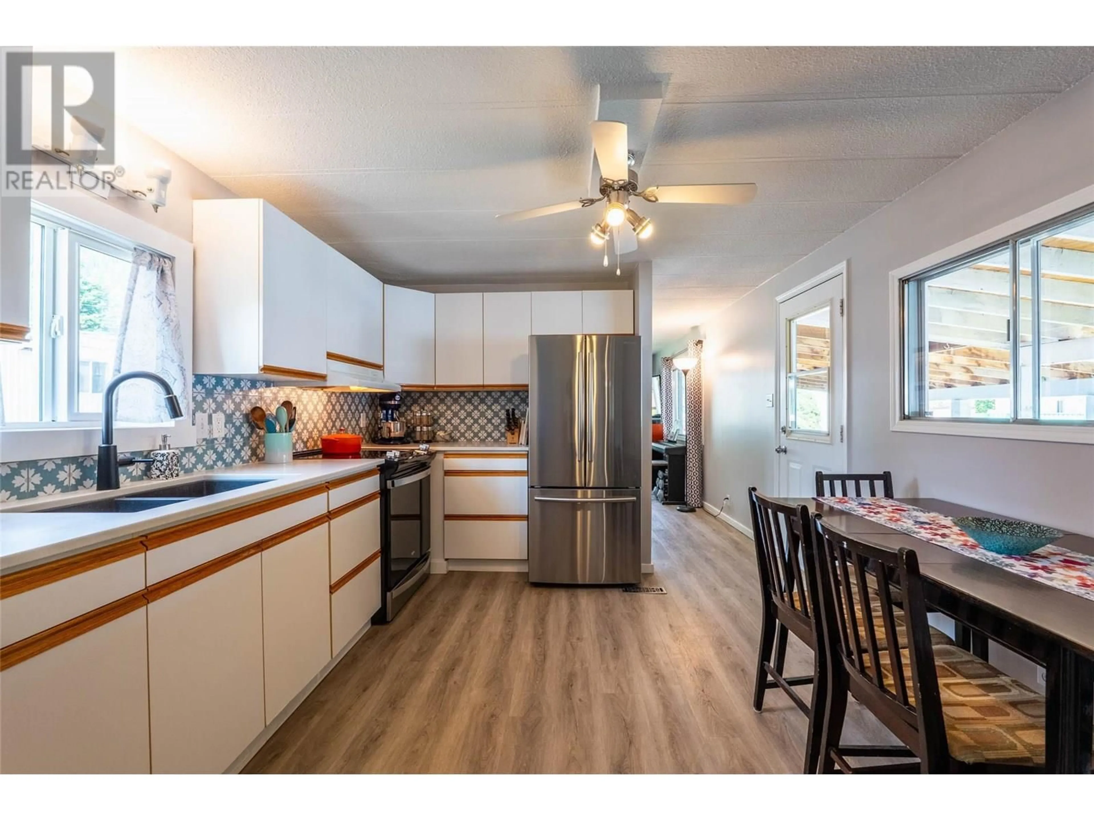 Open concept kitchen, wood/laminate floor for 32 - 2756 GREENWOOD ROAD, Nelson British Columbia V1L6L2