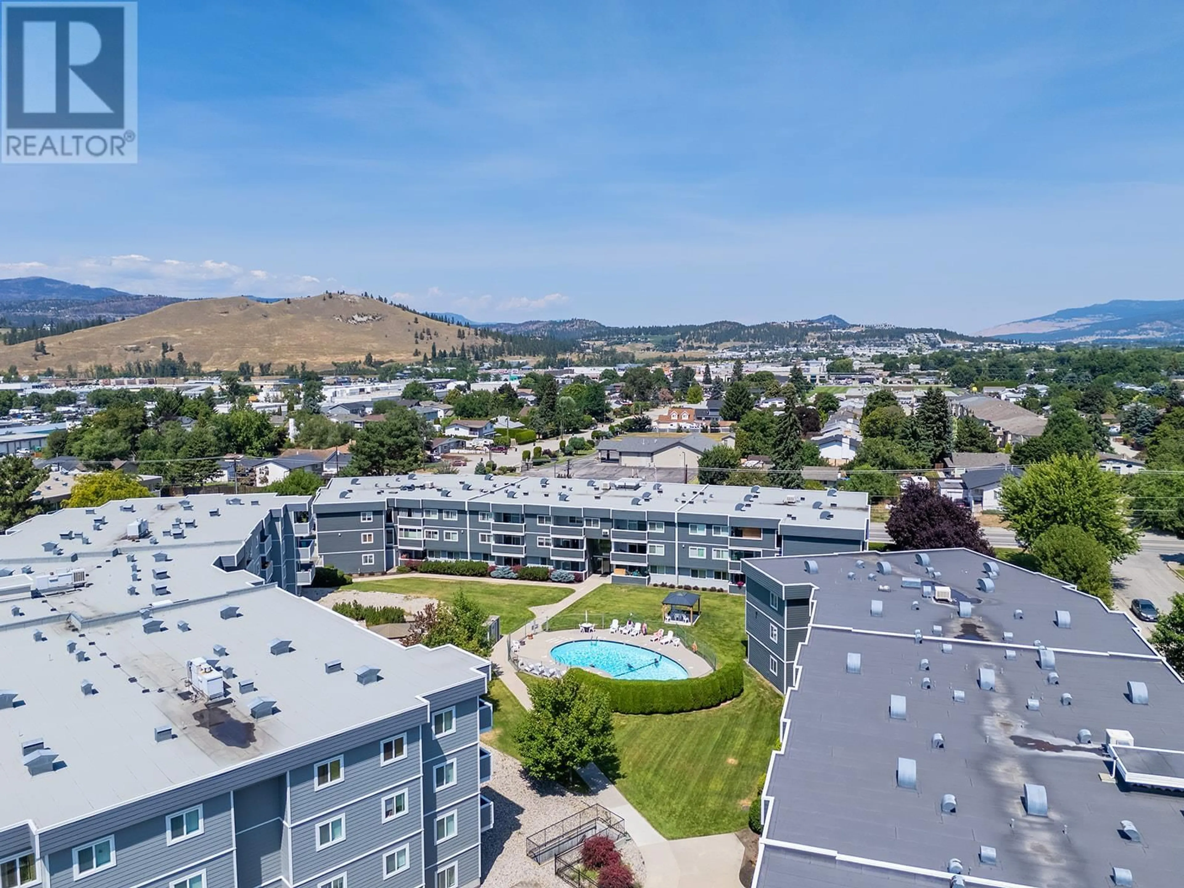 A pic from outside/outdoor area/front of a property/back of a property/a pic from drone, mountain view for 329 - 495 ALL STAR COURT, Kelowna British Columbia V1X5N7