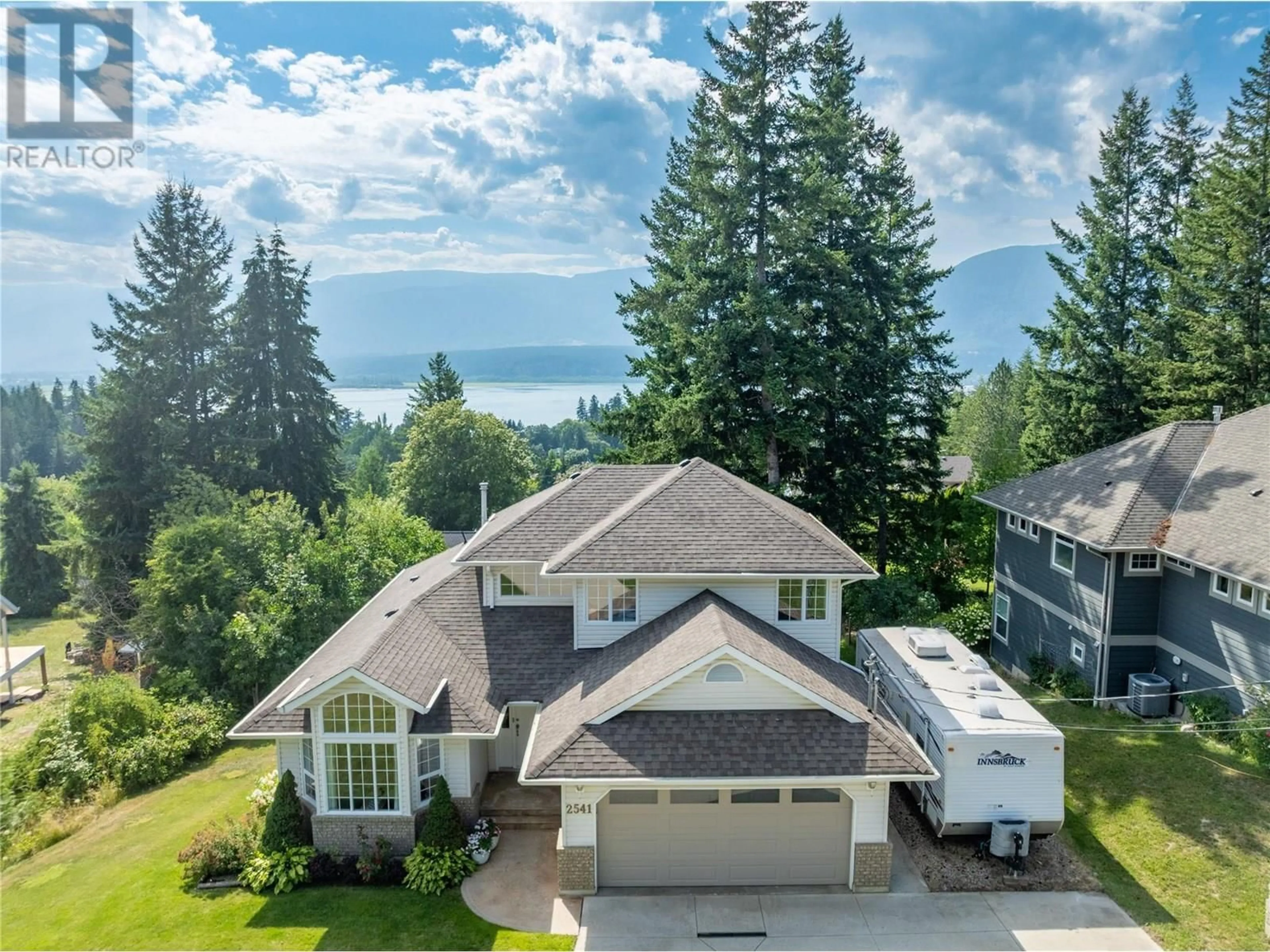 A pic from outside/outdoor area/front of a property/back of a property/a pic from drone, water/lake/river/ocean view for 2541 25 STREET NORTHEAST, Salmon Arm British Columbia V1E2Z7