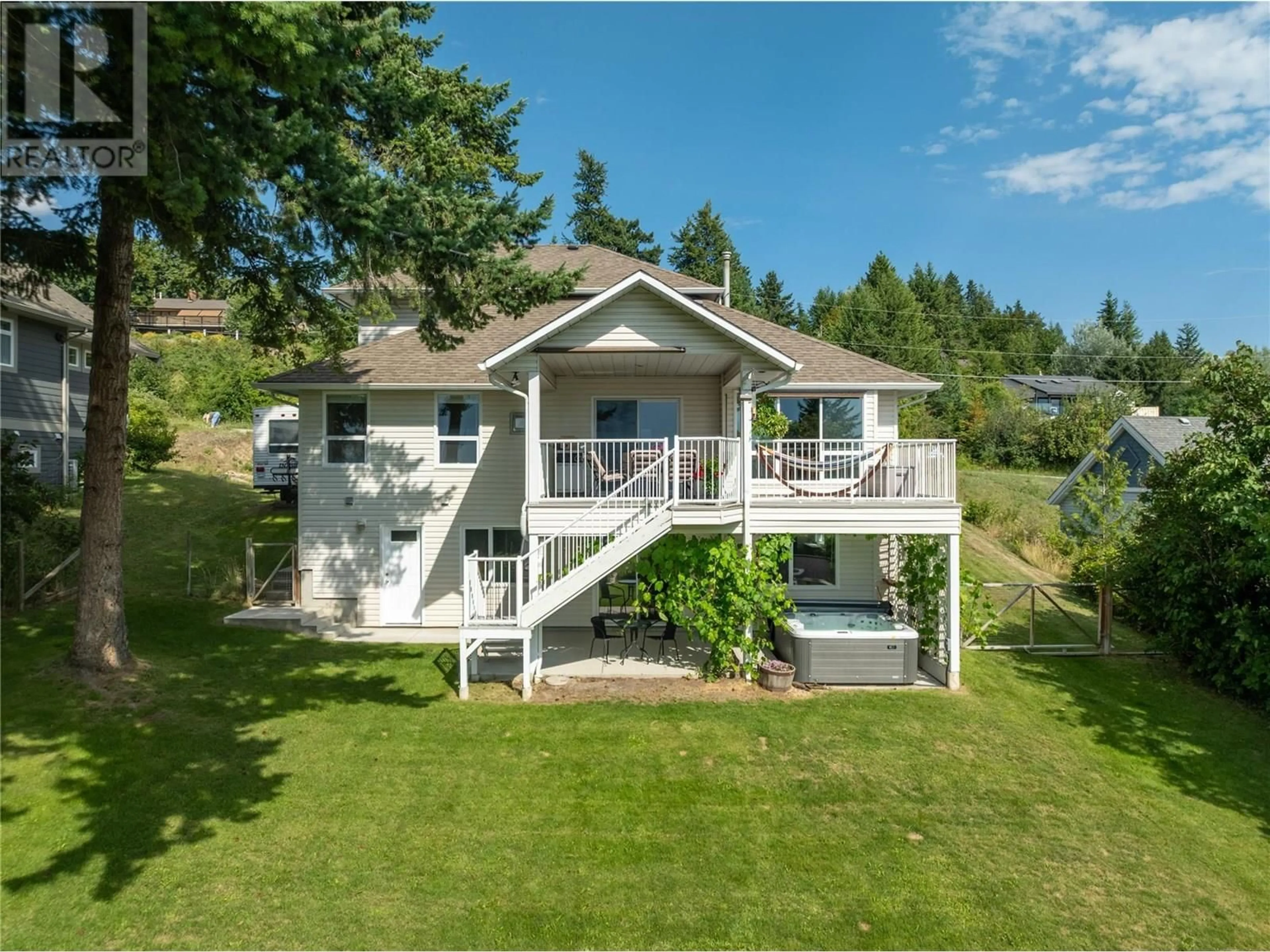 A pic from outside/outdoor area/front of a property/back of a property/a pic from drone, water/lake/river/ocean view for 2541 25 STREET NORTHEAST, Salmon Arm British Columbia V1E2Z7