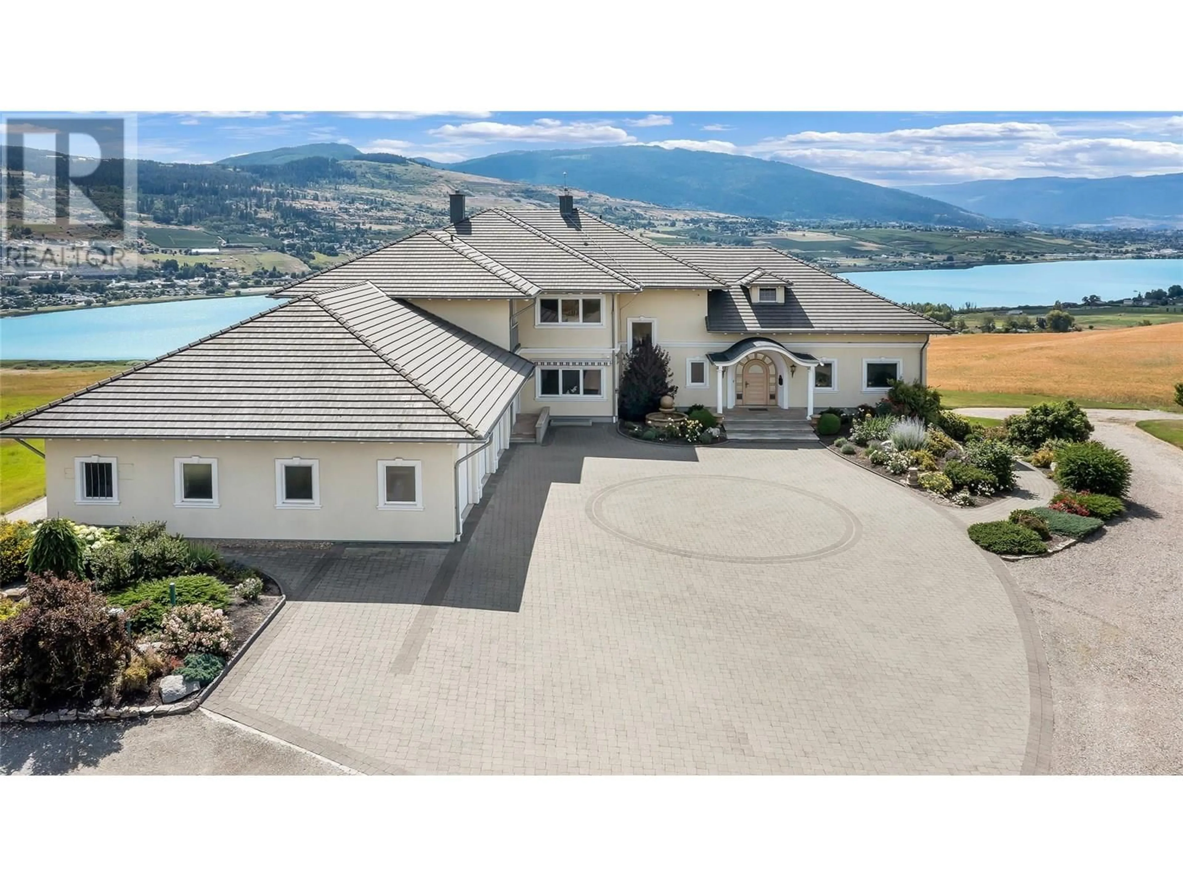 A pic from outside/outdoor area/front of a property/back of a property/a pic from drone, mountain view for 202 STEPPING STONES CRESCENT, Spallumcheen British Columbia V1H1X2