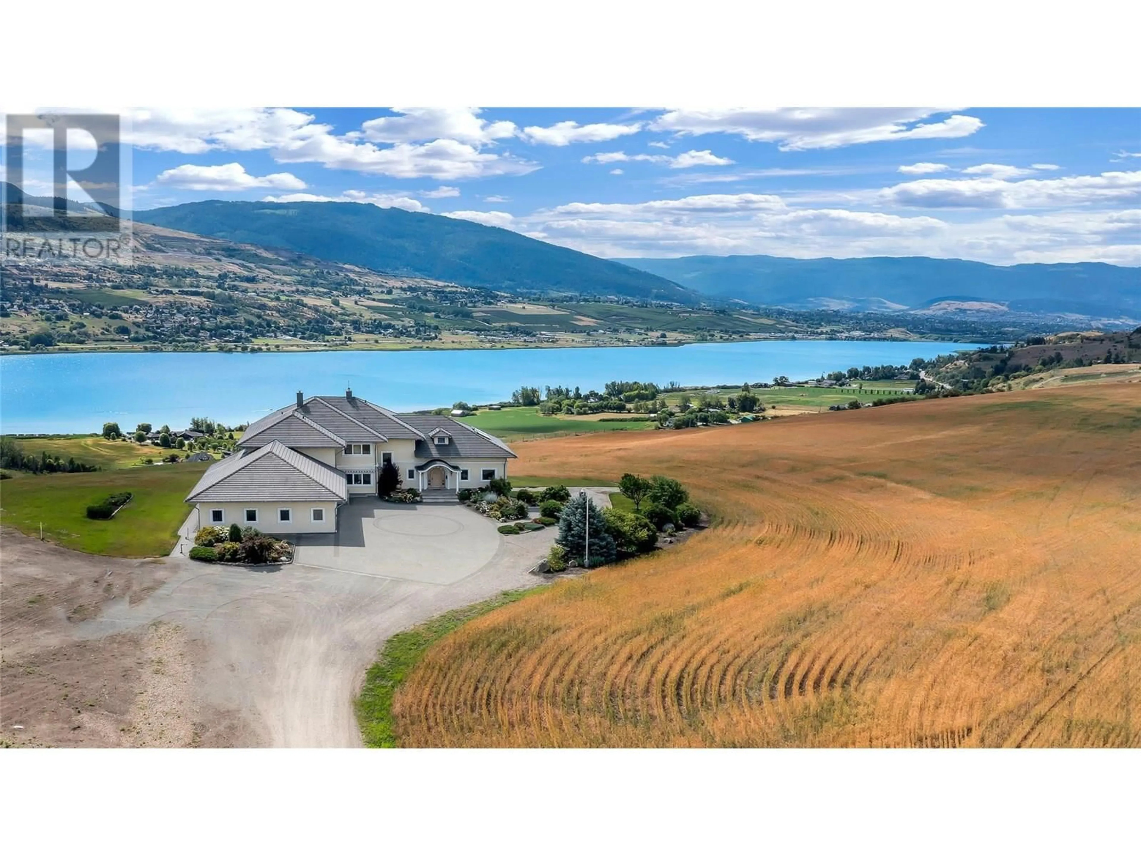 A pic from outside/outdoor area/front of a property/back of a property/a pic from drone, water/lake/river/ocean view for 202 STEPPING STONES CRESCENT, Spallumcheen British Columbia V1H1X2