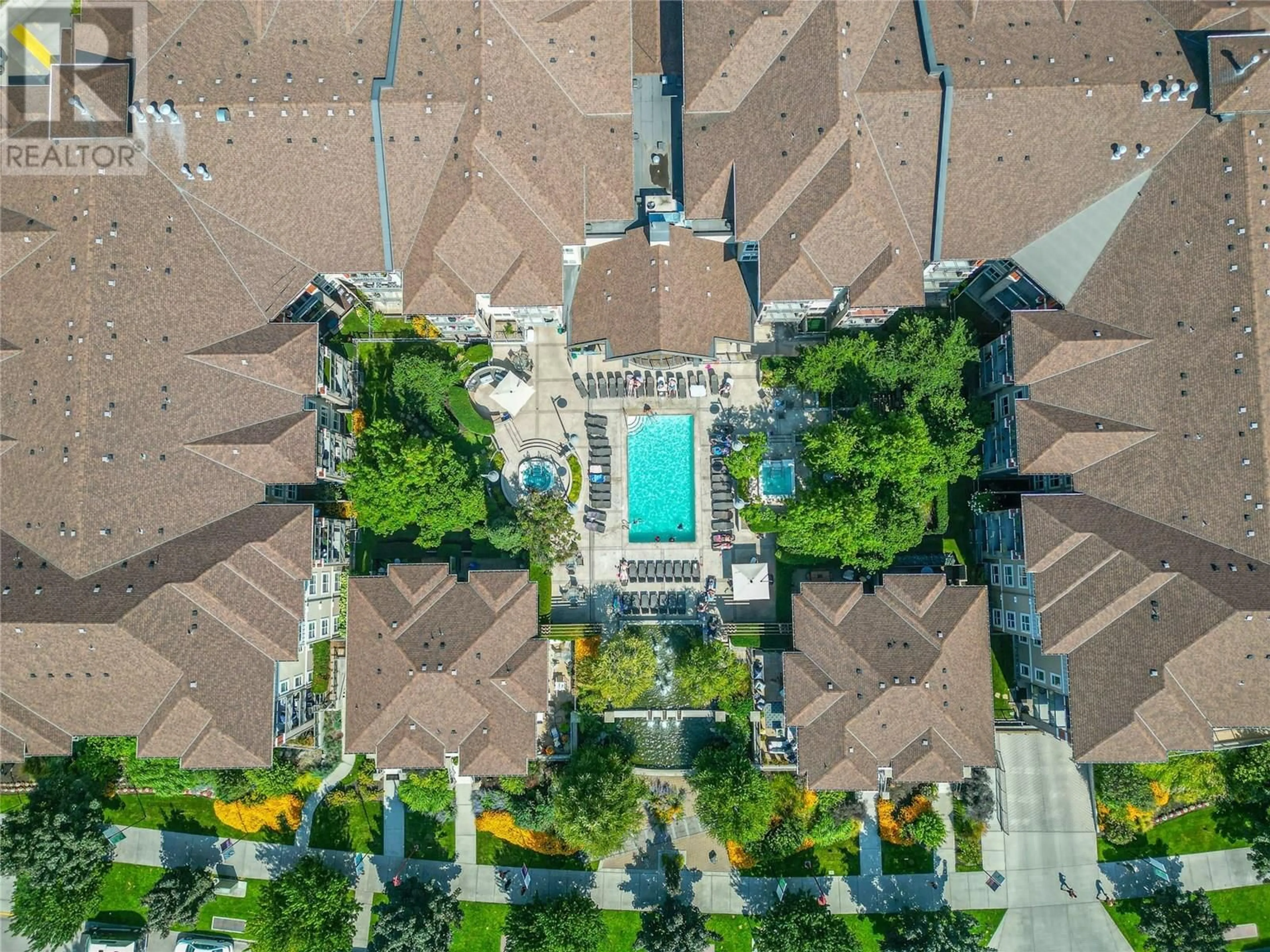 A pic from outside/outdoor area/front of a property/back of a property/a pic from drone, unknown for 441 - 1099 SUNSET DRIVE, Kelowna British Columbia V1Y9Z2