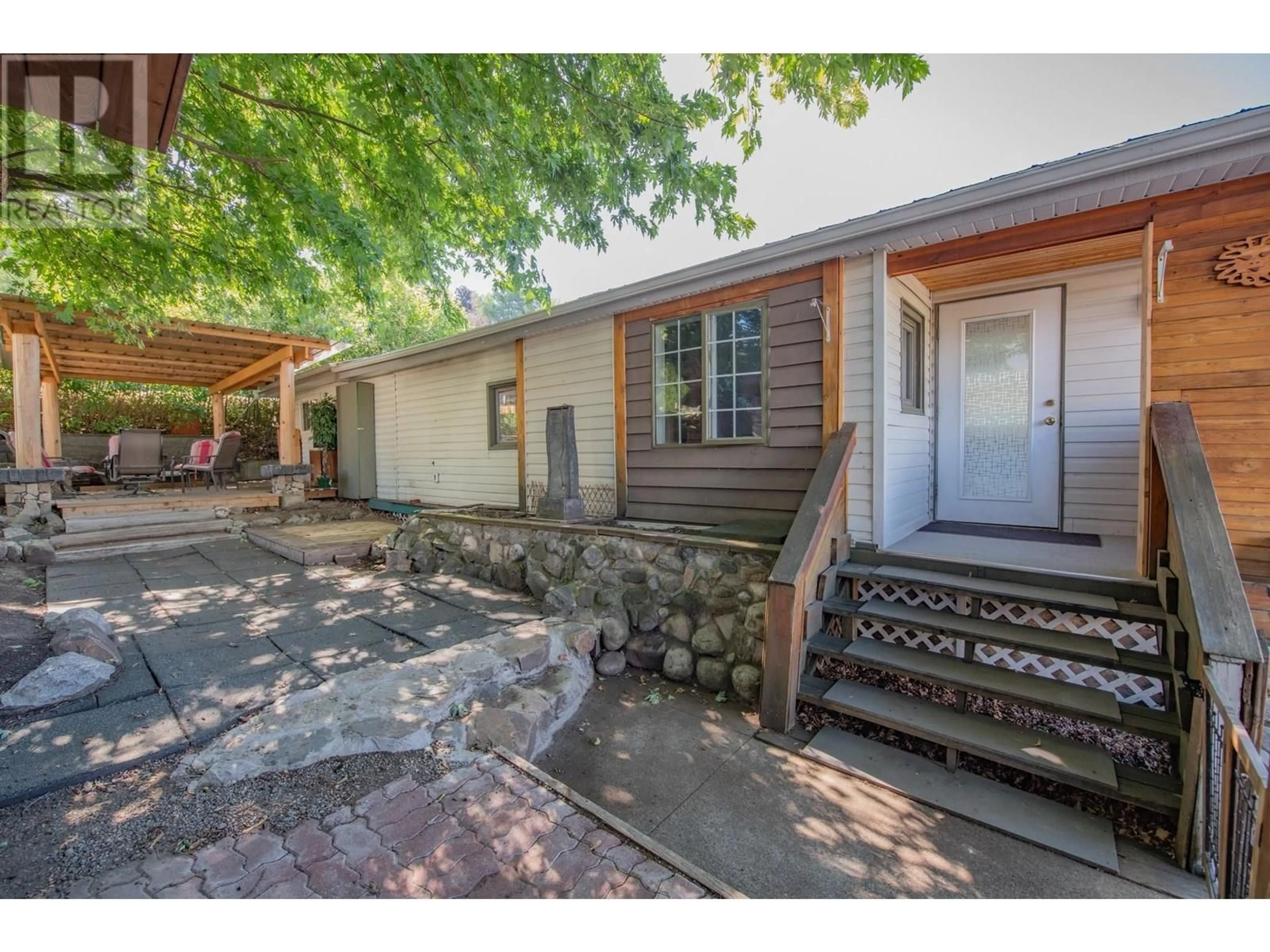A pic from outside/outdoor area/front of a property/back of a property/a pic from drone, street for 211 - 15401 KALAMALKA ROAD, Coldstream British Columbia V1B1Z3