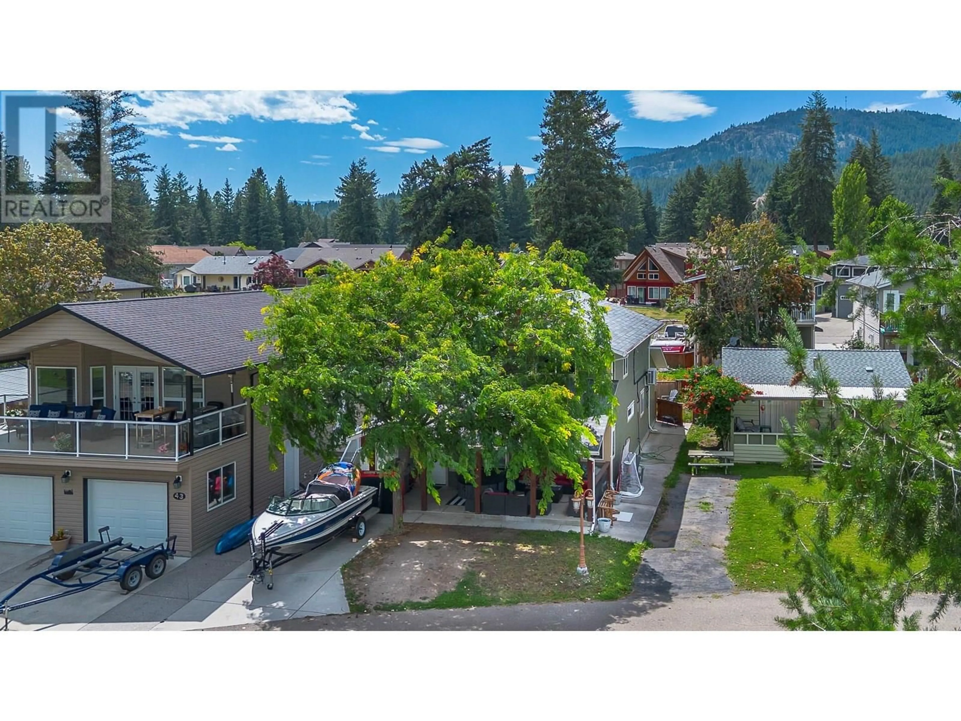 A pic from outside/outdoor area/front of a property/back of a property/a pic from drone, mountain view for 42 LAKESHORE DRIVE, Vernon British Columbia V1H2A1