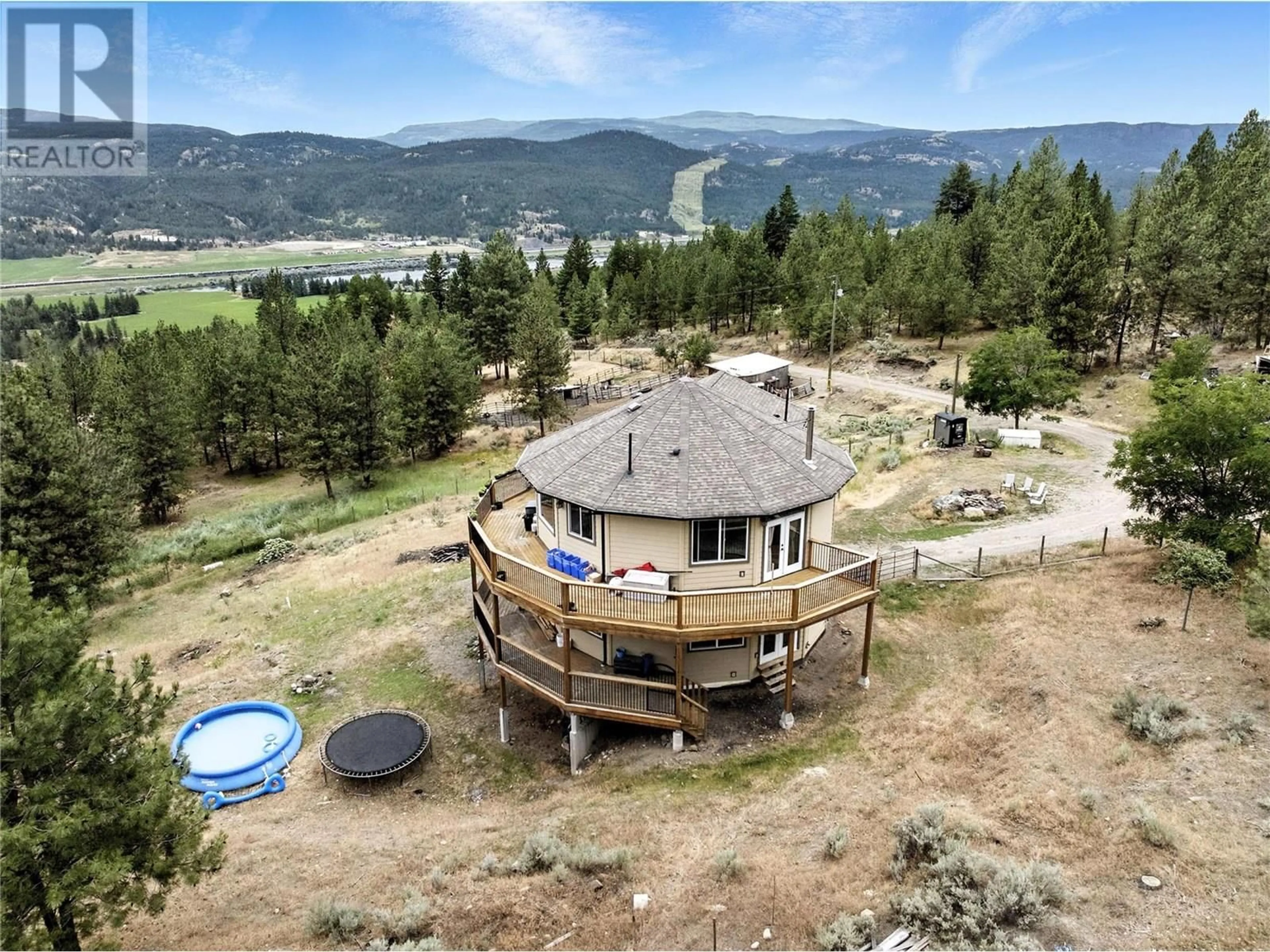 A pic from outside/outdoor area/front of a property/back of a property/a pic from drone, mountain view for 4377 SHUSWAP ROAD, Kamloops British Columbia V0E2P0