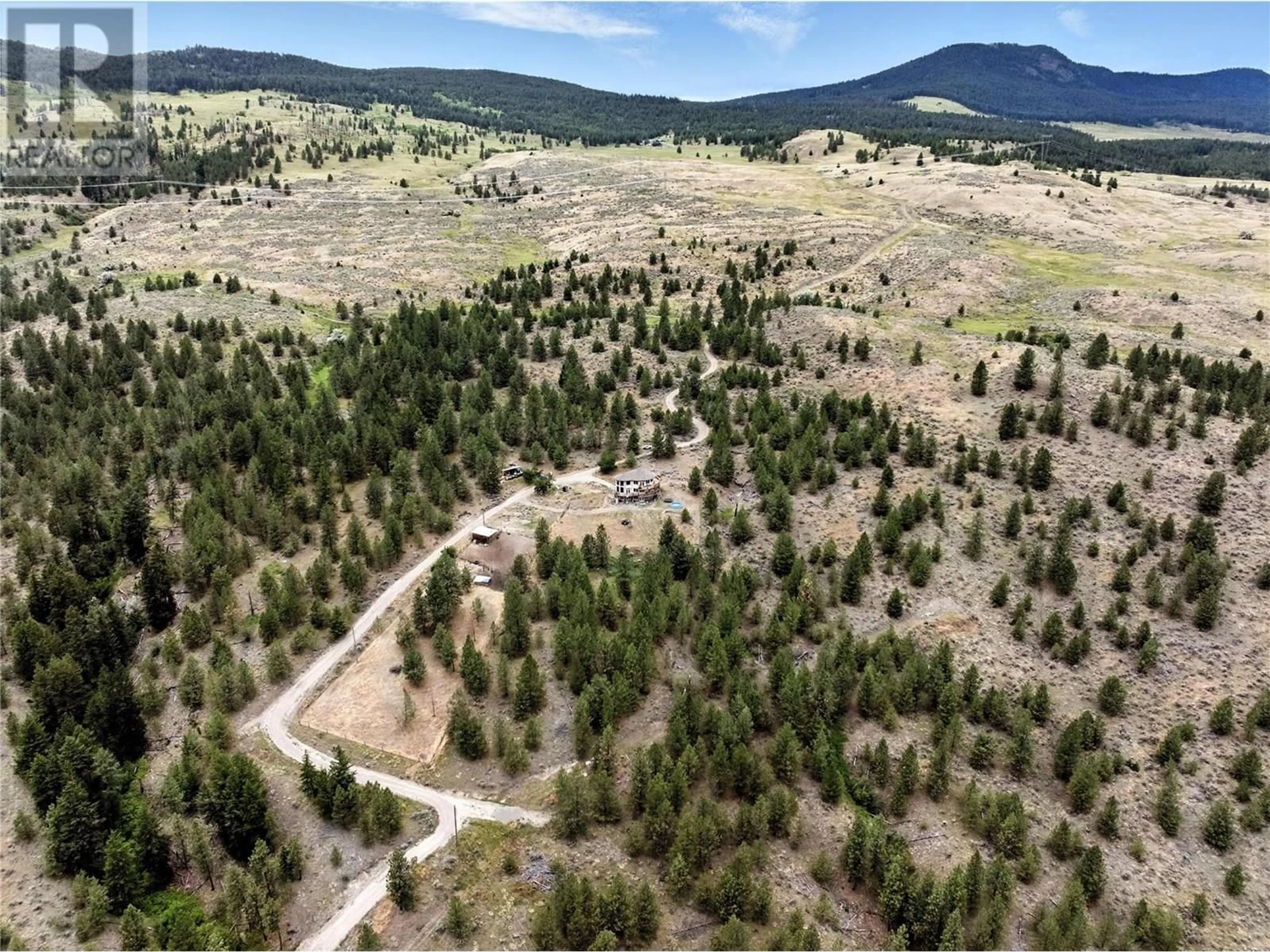 A pic from outside/outdoor area/front of a property/back of a property/a pic from drone, mountain view for 4377 SHUSWAP ROAD, Kamloops British Columbia V0E2P0