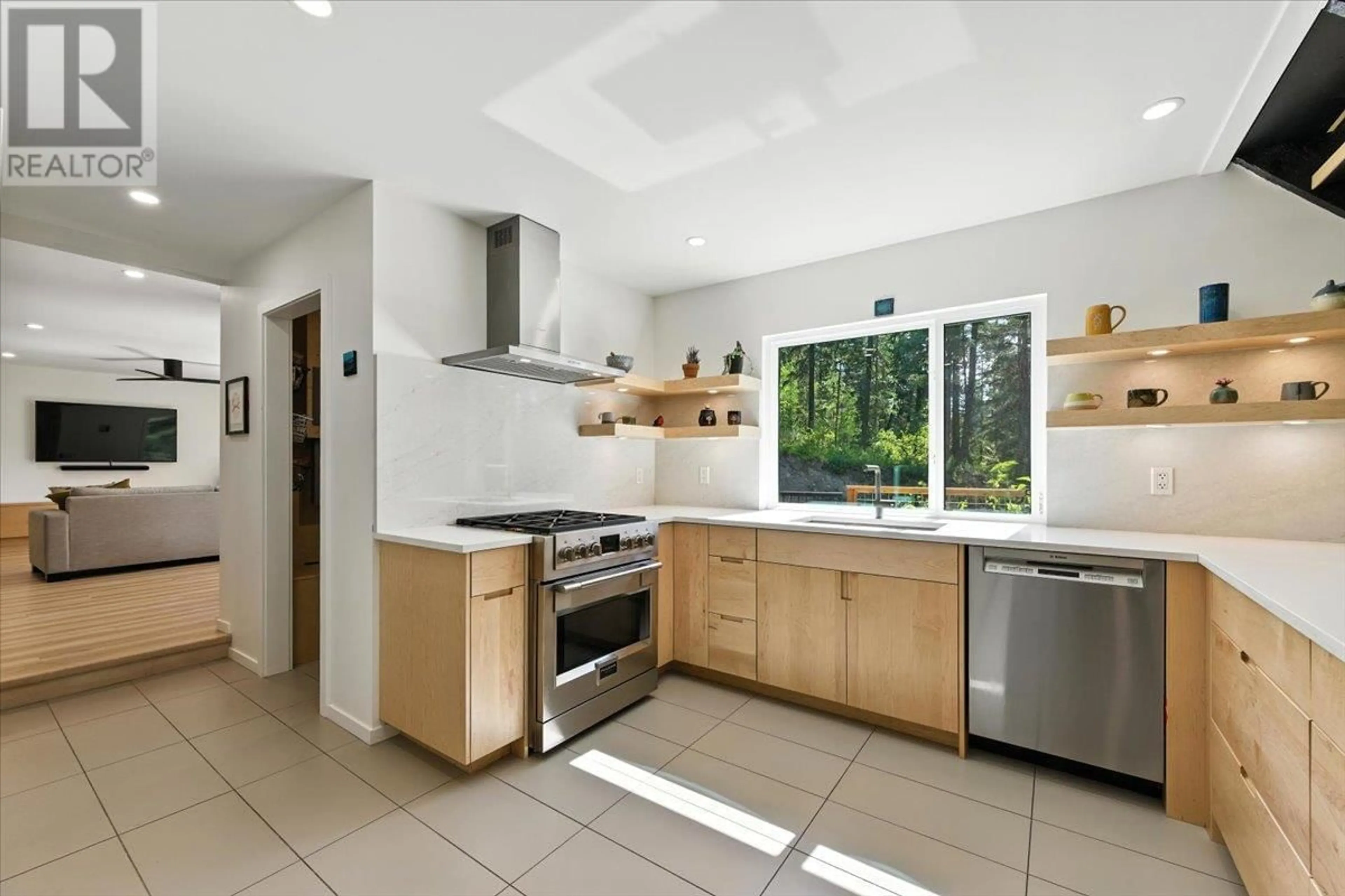Open concept kitchen, ceramic/tile floor for 8280 ROGERS ROAD, Vernon British Columbia V1B3M7