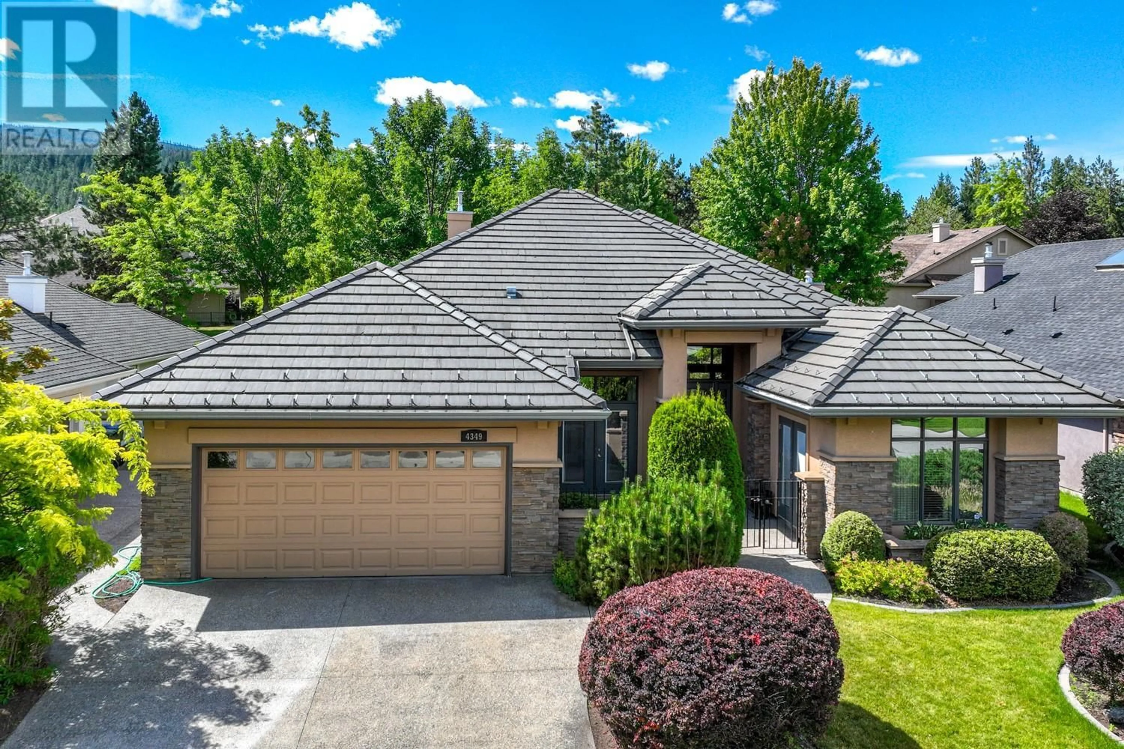 Home with brick exterior material, unknown for 4349 GALLAGHERS FAIRWAY SOUTH, Kelowna British Columbia V1W4X4