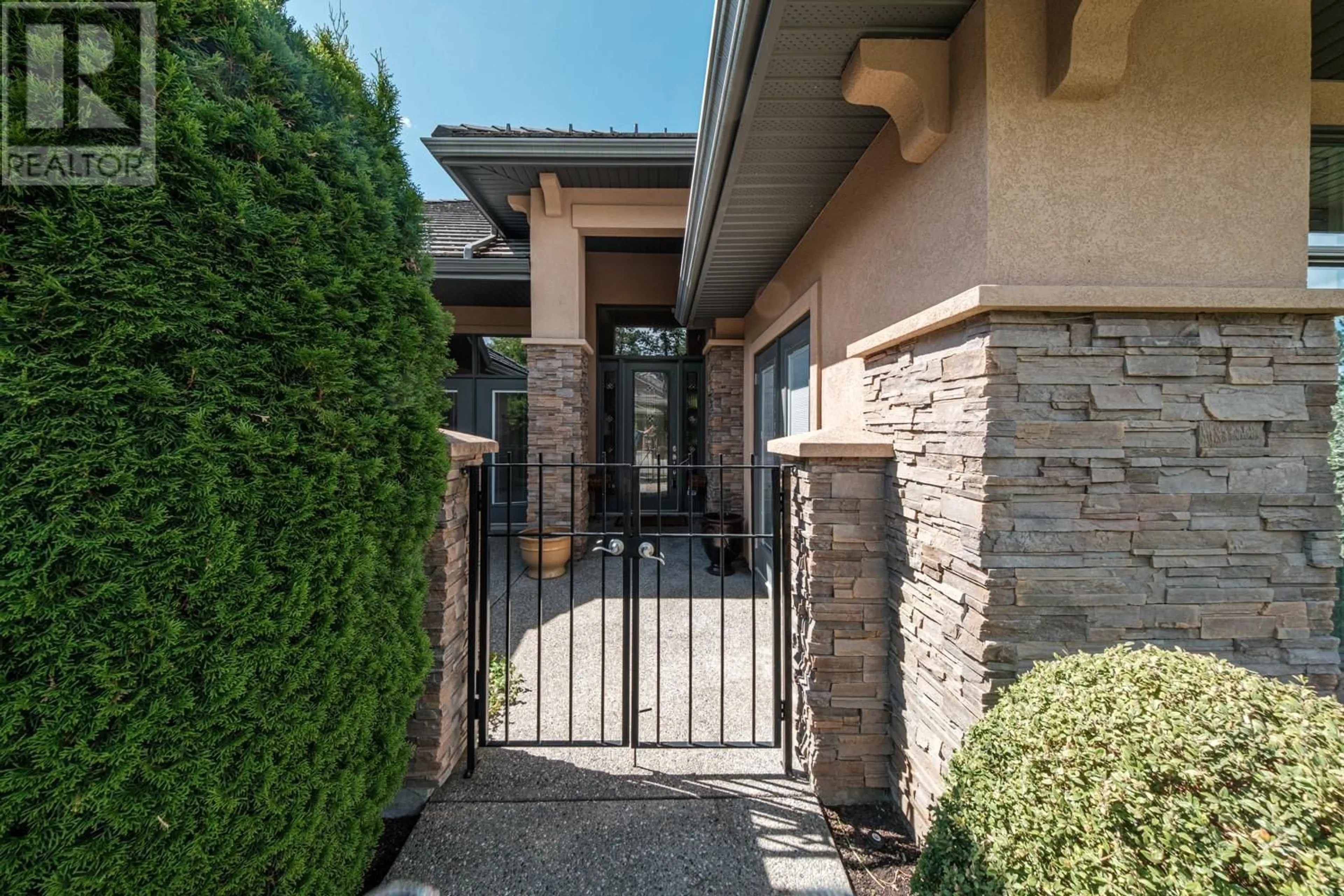 Home with brick exterior material, street for 4349 GALLAGHERS FAIRWAY SOUTH, Kelowna British Columbia V1W4X4