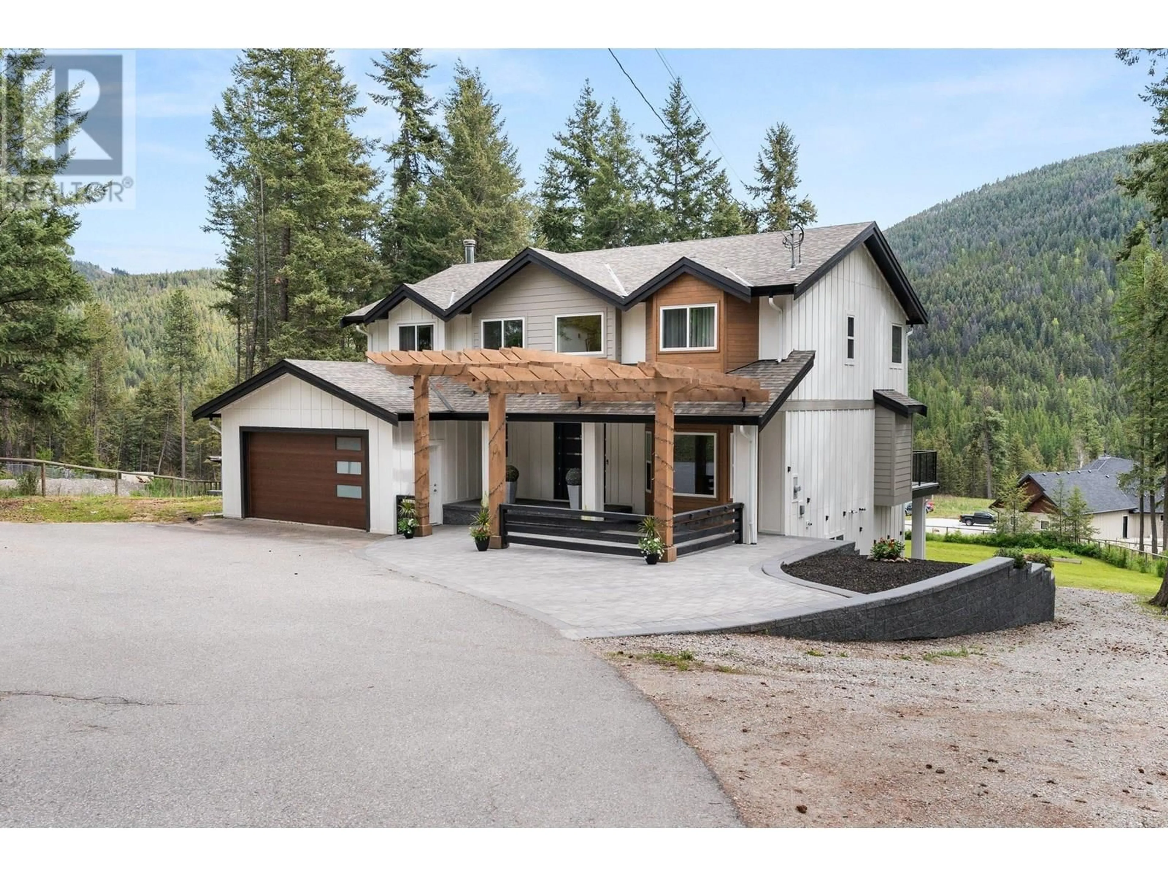 A pic from outside/outdoor area/front of a property/back of a property/a pic from drone, mountain view for 7967 FALCON RIDGE CRESCENT, Kelowna British Columbia V1P1J2