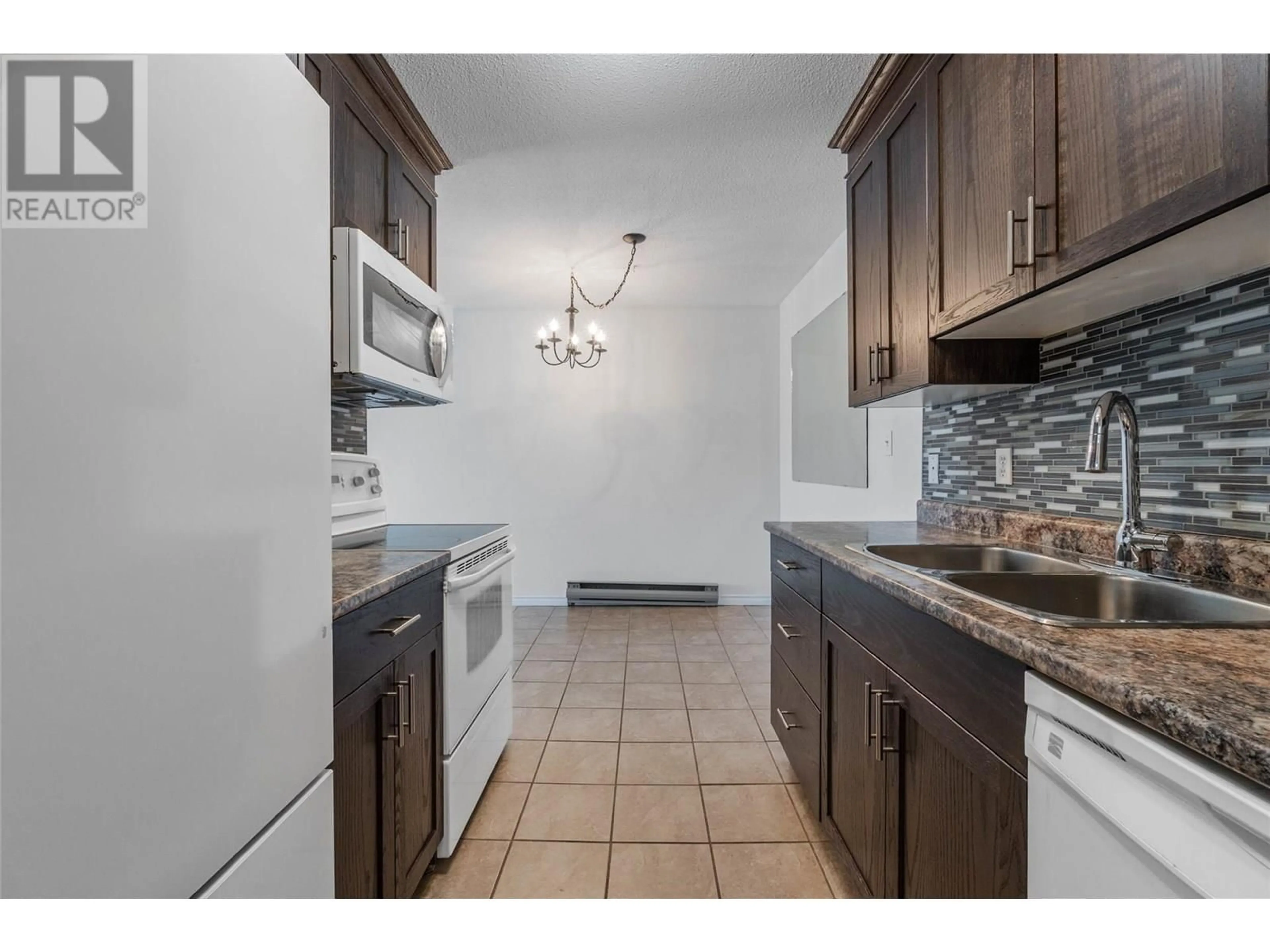 Standard kitchen, ceramic/tile floor for 405 - 110 SKAHA PLACE, Penticton British Columbia V2A7L1