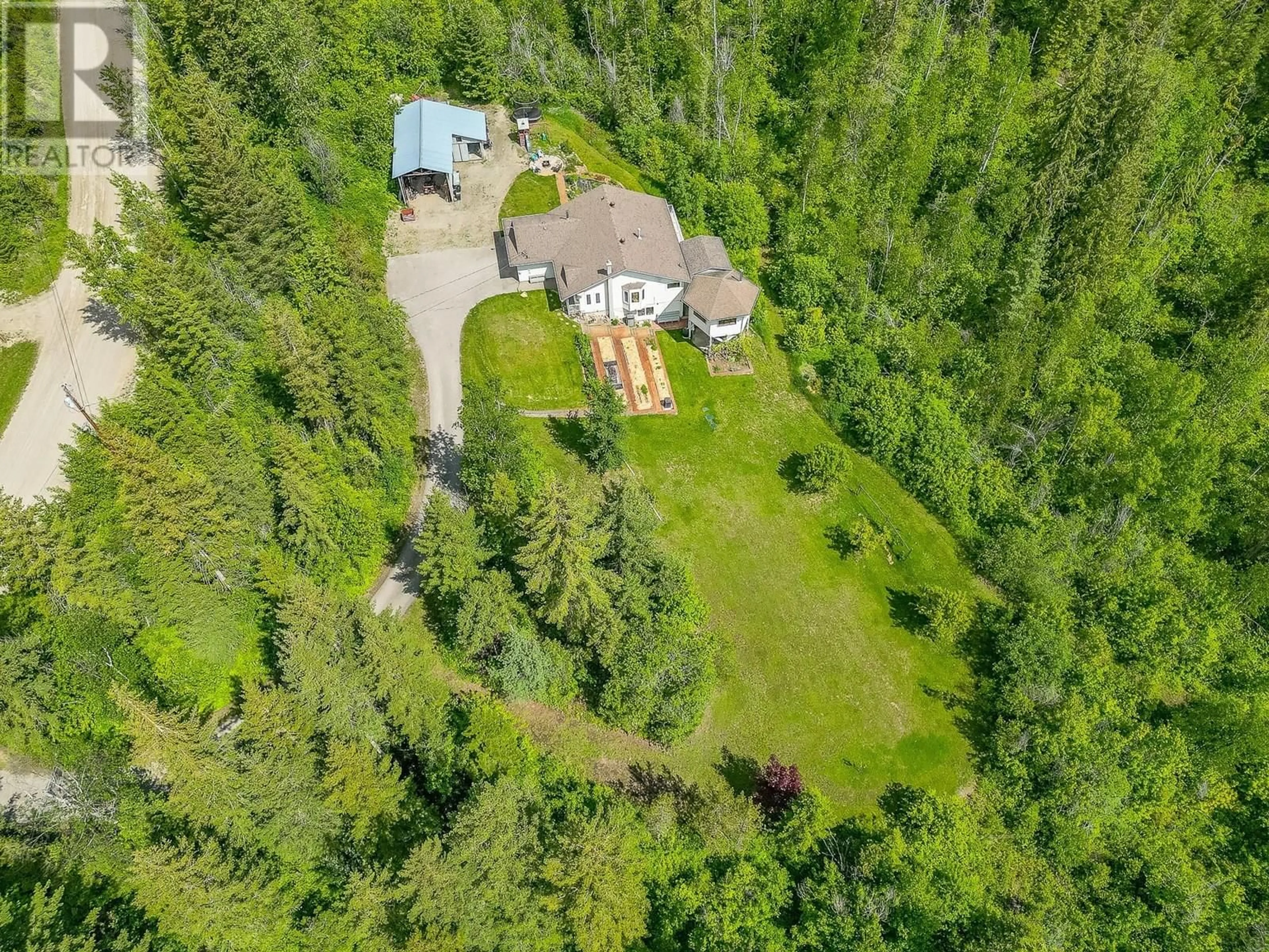 A pic from outside/outdoor area/front of a property/back of a property/a pic from drone, forest/trees view for 65 GROVE ROAD, Enderby British Columbia V0E1V3