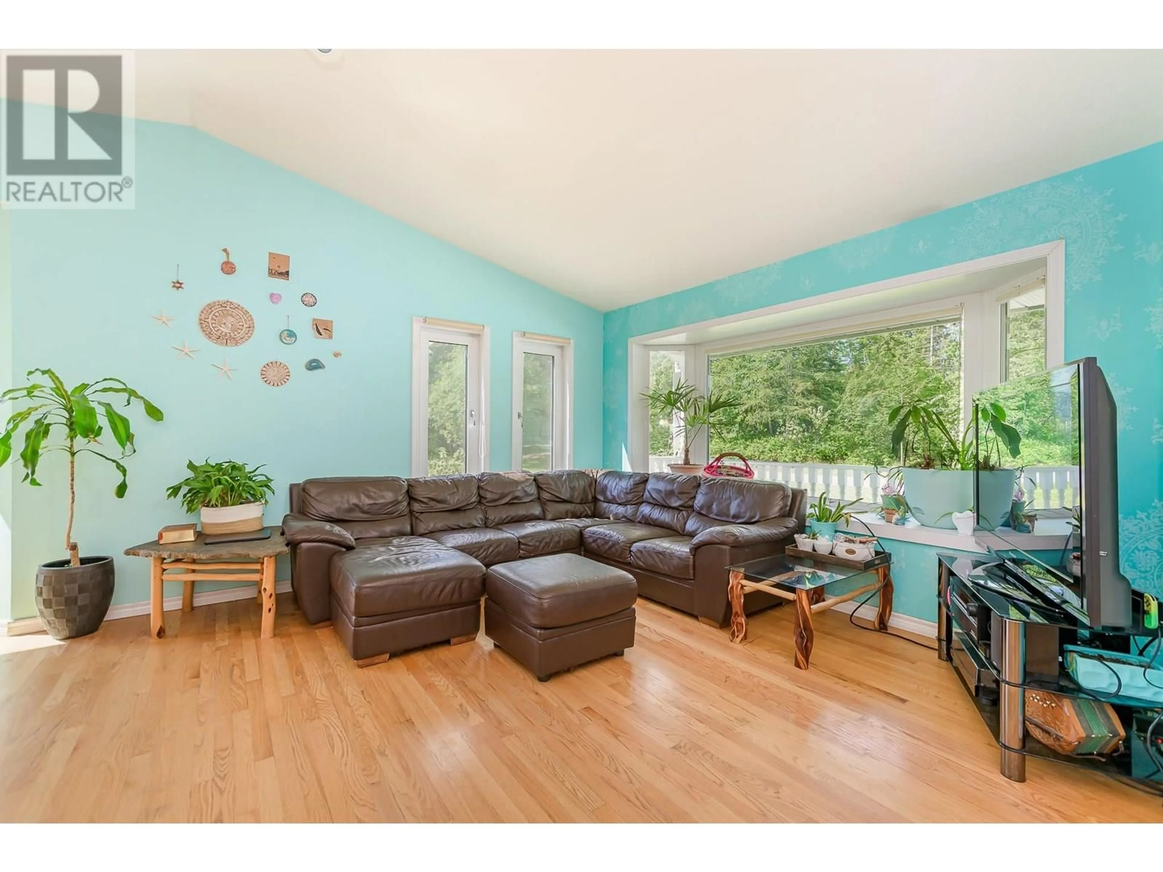 Living room with furniture, wood/laminate floor for 65 GROVE ROAD, Enderby British Columbia V0E1V3