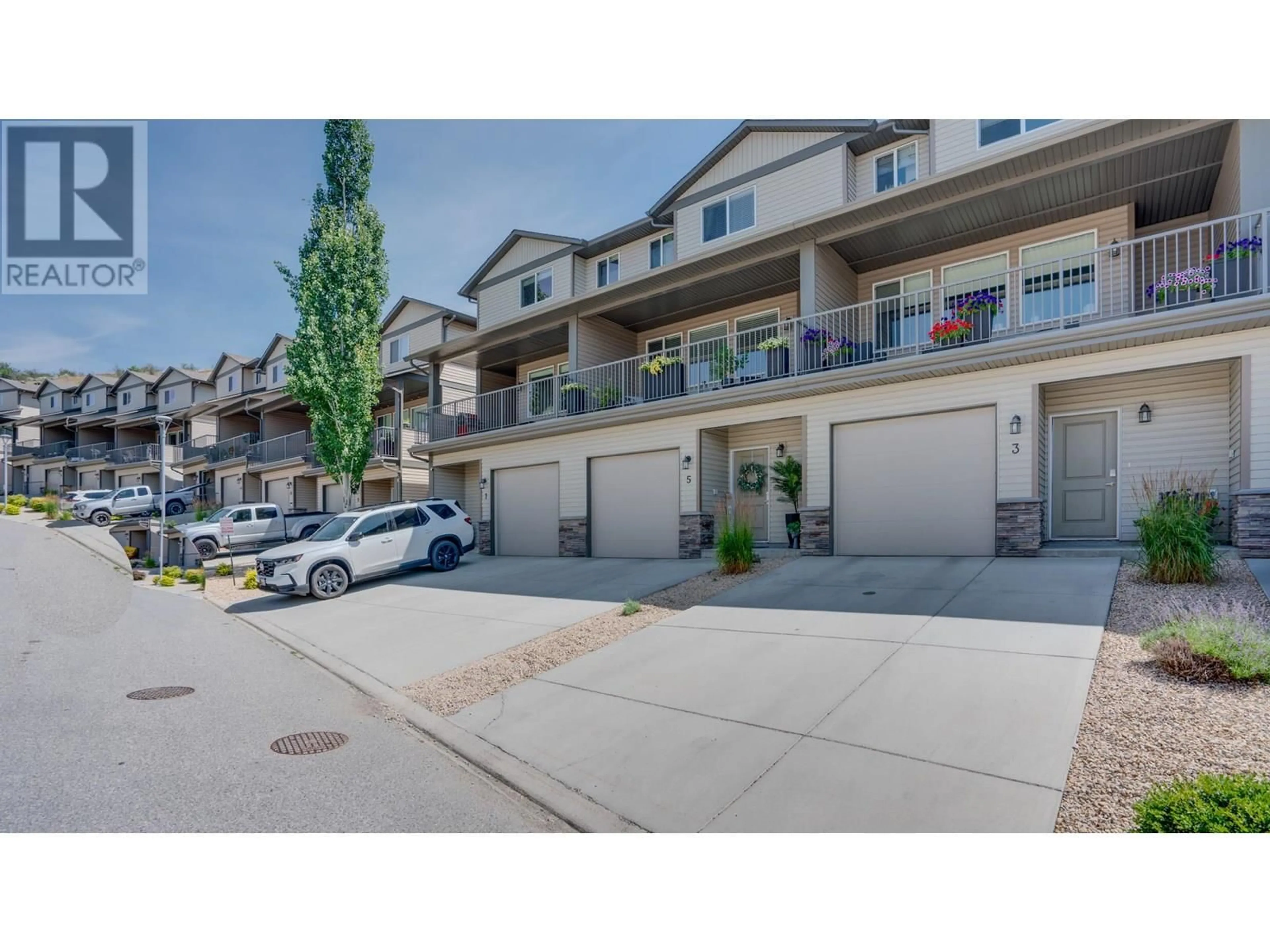 A pic from outside/outdoor area/front of a property/back of a property/a pic from drone, street for 3 - 933 MT ROBSON PLACE, Vernon British Columbia V1B4G4