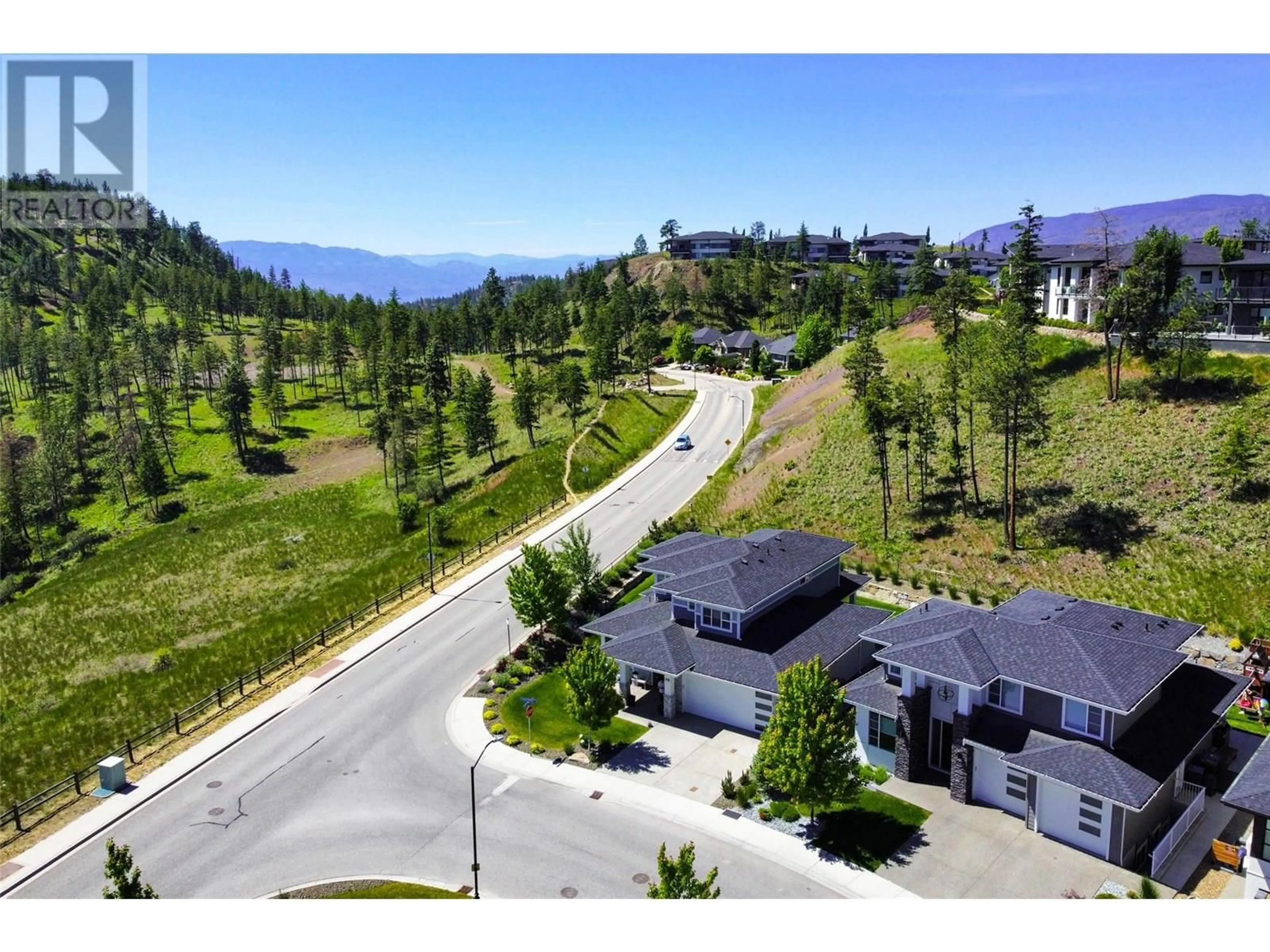 A pic from outside/outdoor area/front of a property/back of a property/a pic from drone, mountain view for 218 ECHO RIDGE DRIVE, Kelowna British Columbia V1V0C9
