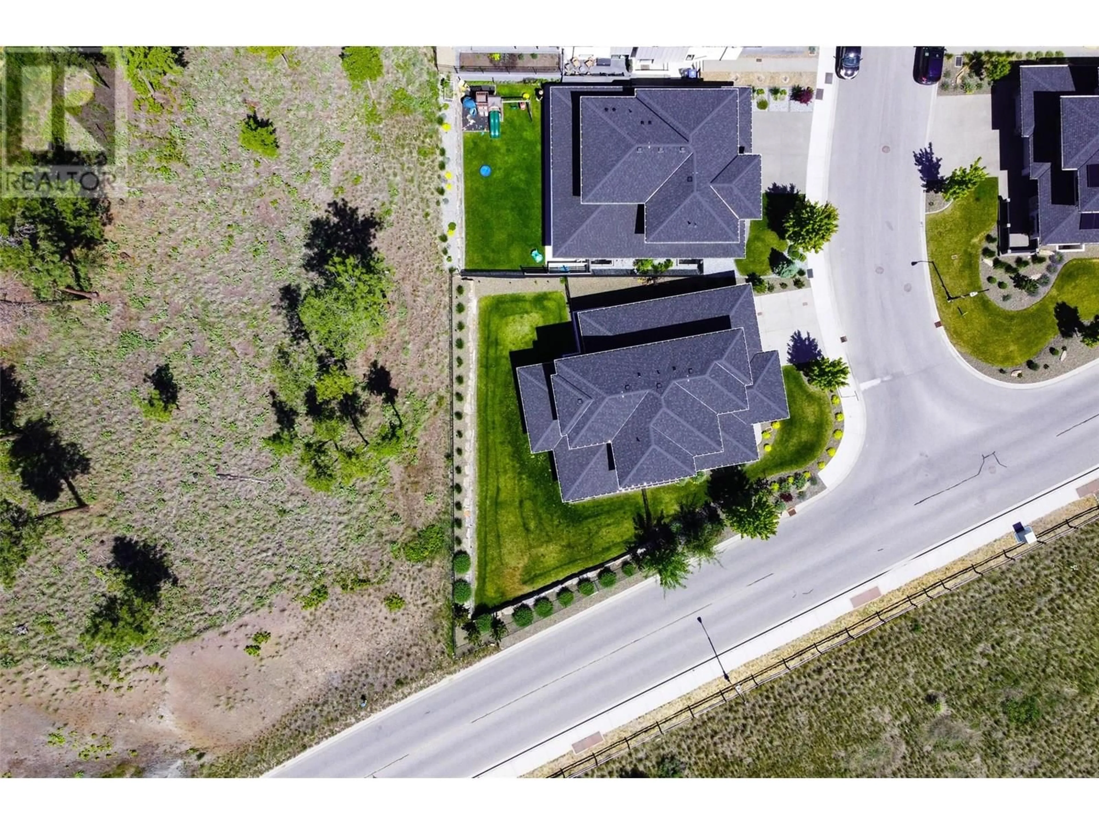 A pic from outside/outdoor area/front of a property/back of a property/a pic from drone, street for 218 ECHO RIDGE DRIVE, Kelowna British Columbia V1V0C9
