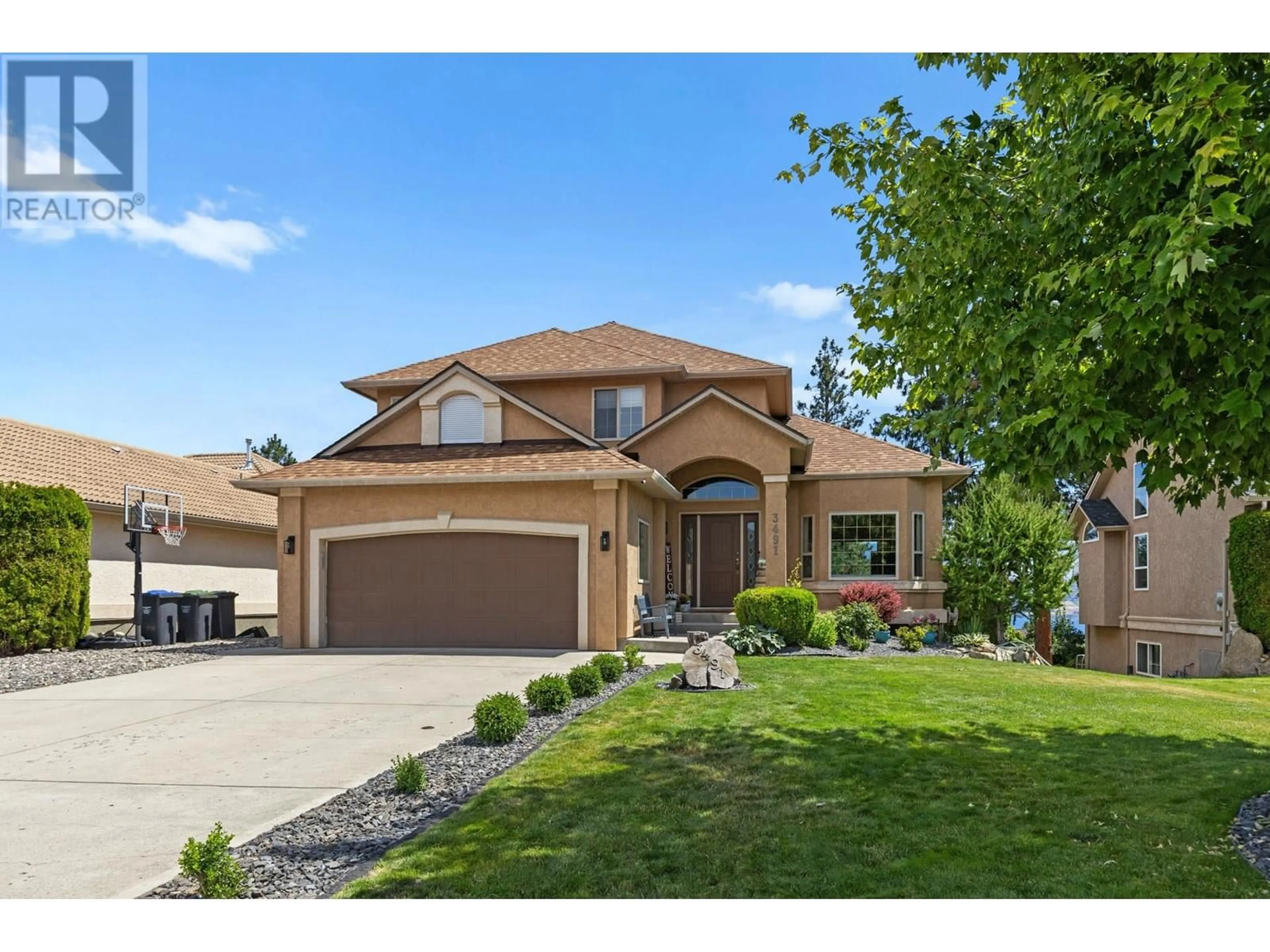 Home with brick exterior material, street for 3491 RIDGE BOULEVARD, West Kelowna British Columbia V4T2T1