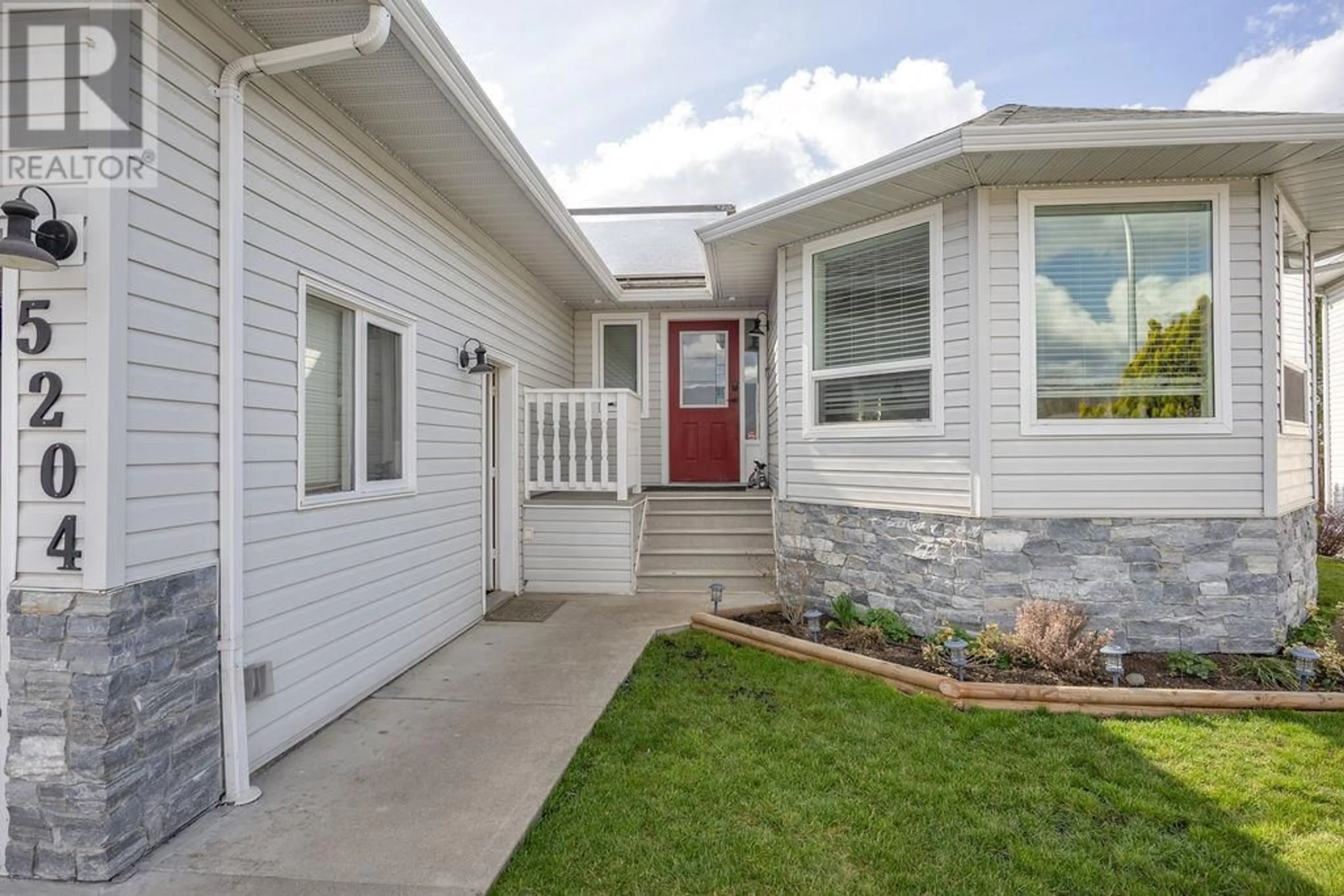 Home with vinyl exterior material, street for 5204 SANDON PLACE, Vernon British Columbia V1H1A3