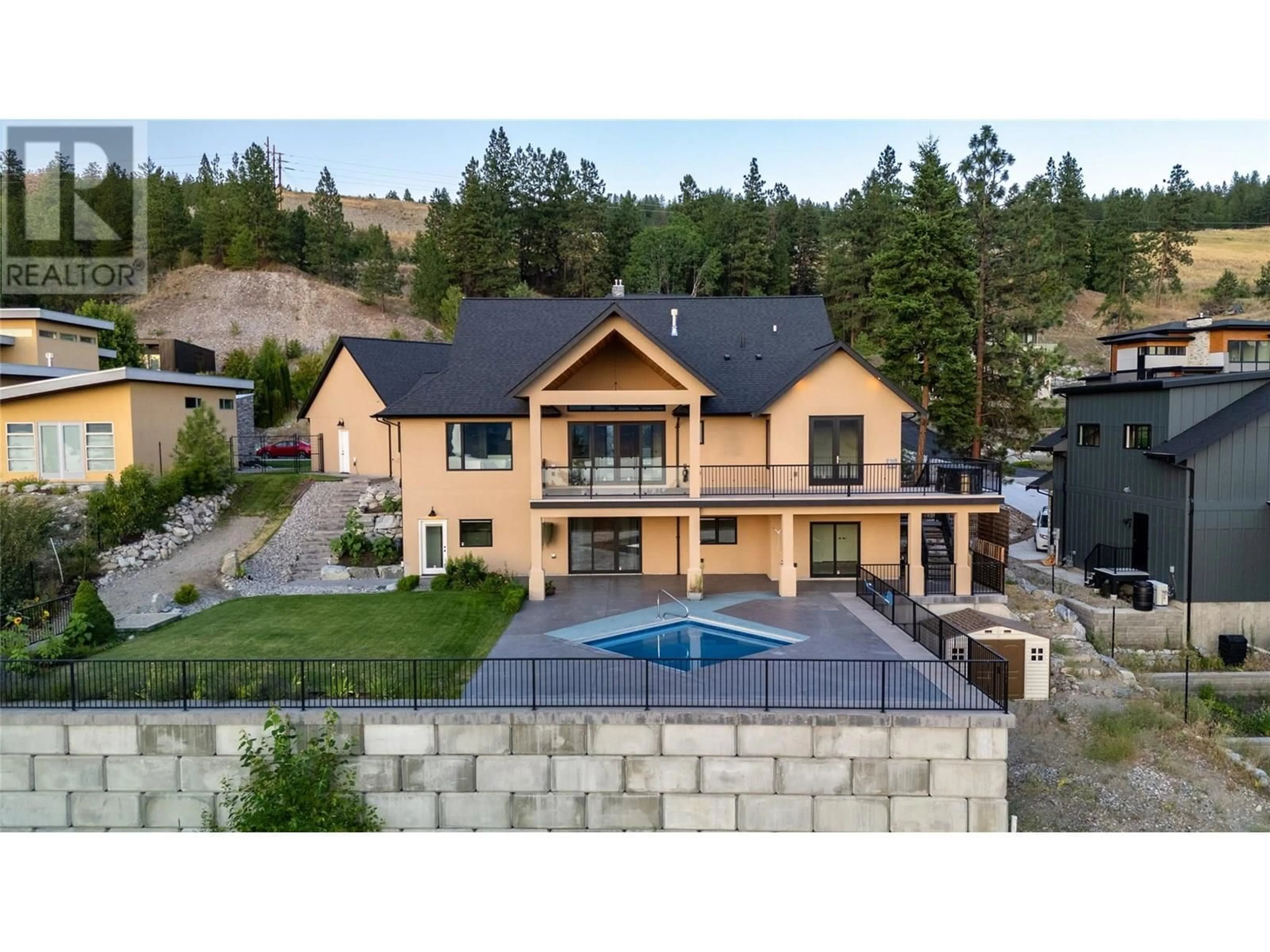 A pic from outside/outdoor area/front of a property/back of a property/a pic from drone, mountain view for 135 FLAGSTONE RISE, Naramata British Columbia V0H1N1