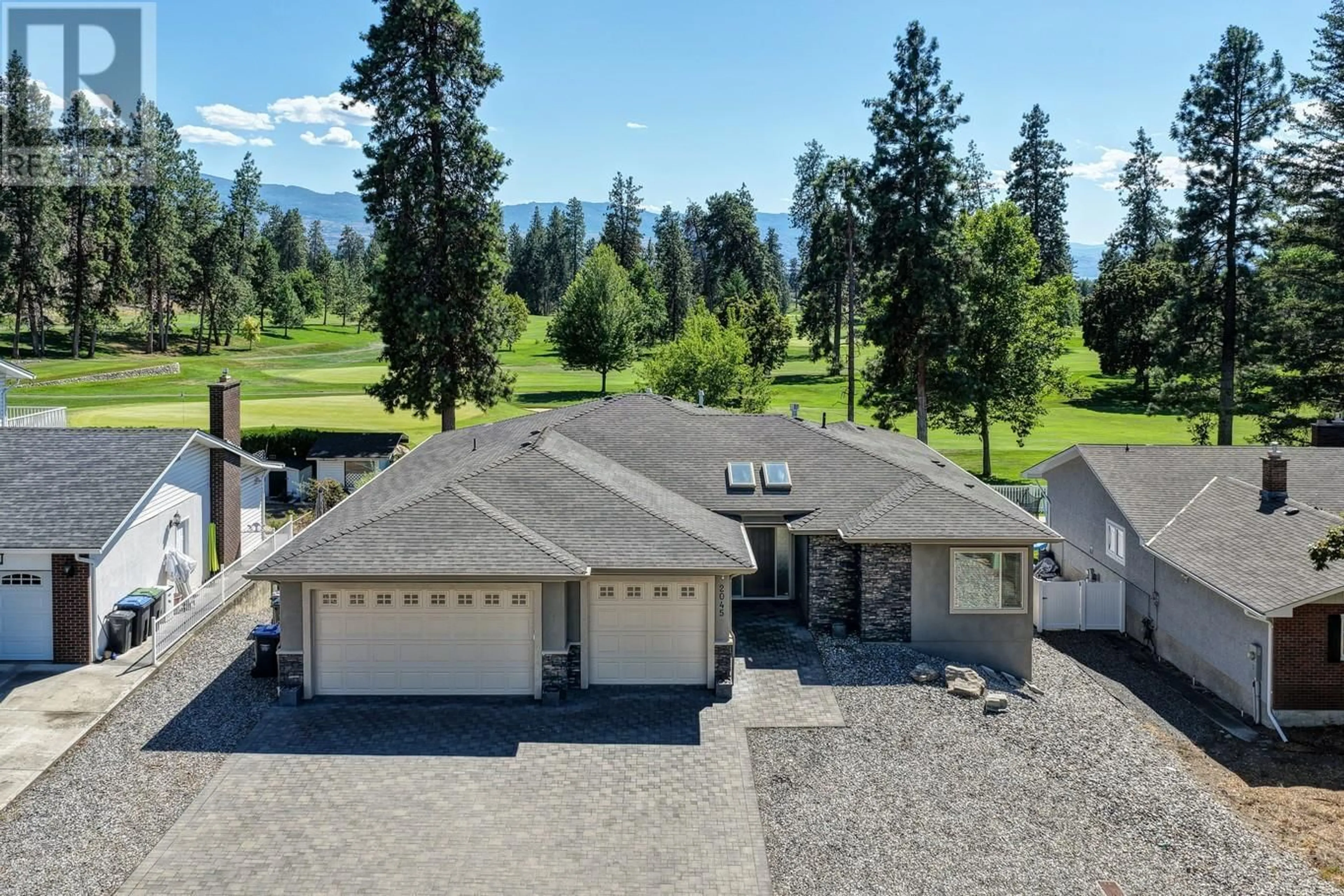 A pic from outside/outdoor area/front of a property/back of a property/a pic from drone, mountain view for 2045 ST. ANDREWS DRIVE, Kelowna British Columbia V1Y4T6