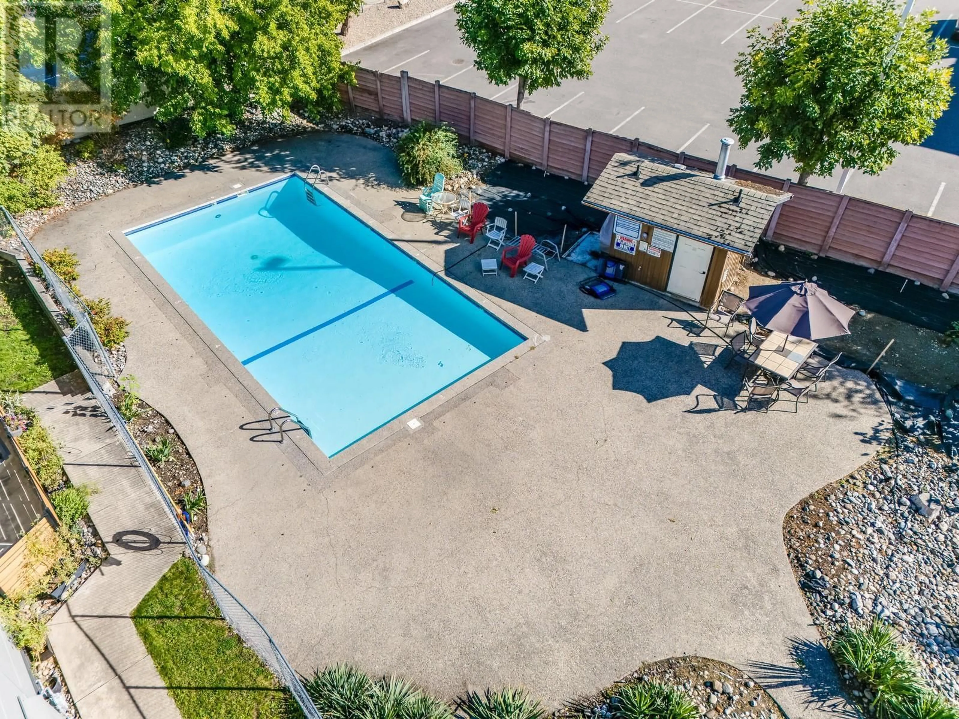 A pic from outside/outdoor area/front of a property/back of a property/a pic from drone, water/lake/river/ocean view for 109 - 2125 BURTCH ROAD, Kelowna British Columbia V1Y8N1