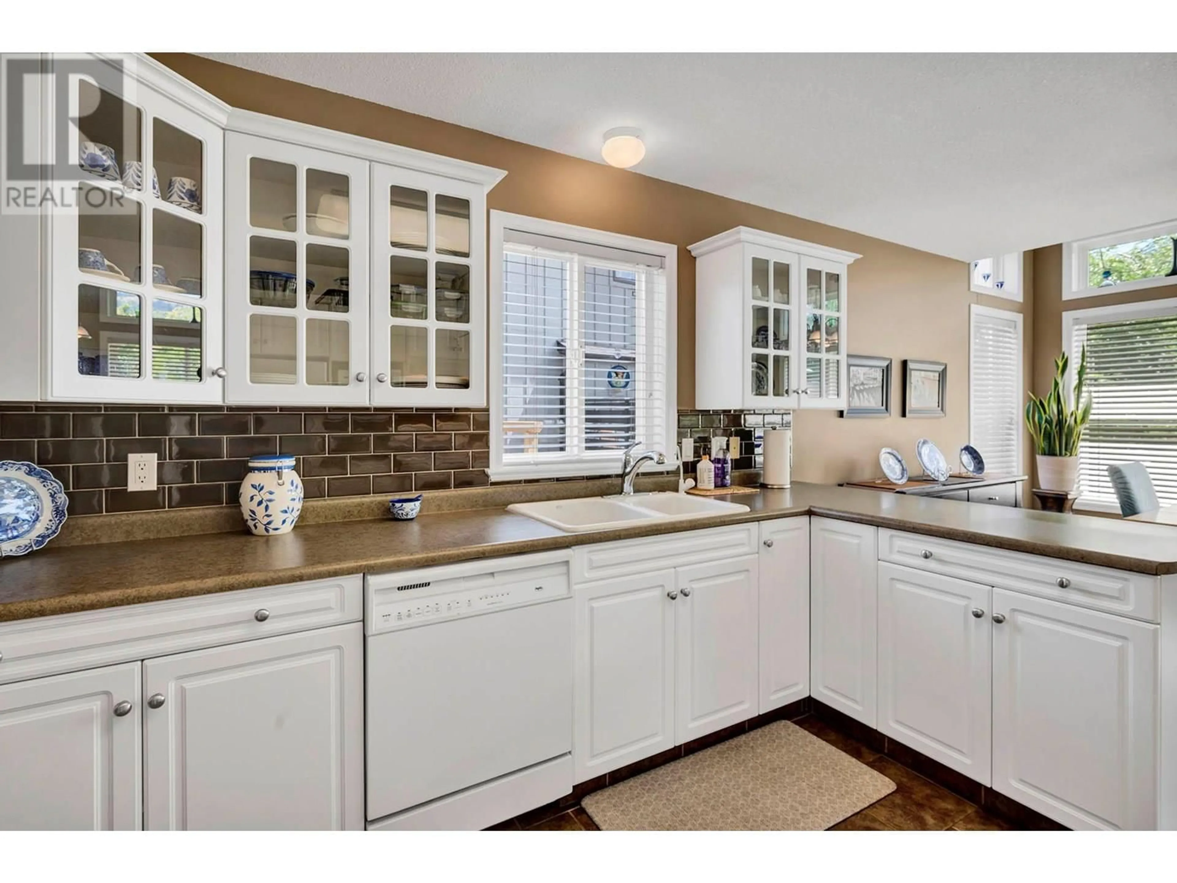 Open concept kitchen, ceramic/tile floor for 5800 TERN PLACE, Vernon British Columbia V1H1R2