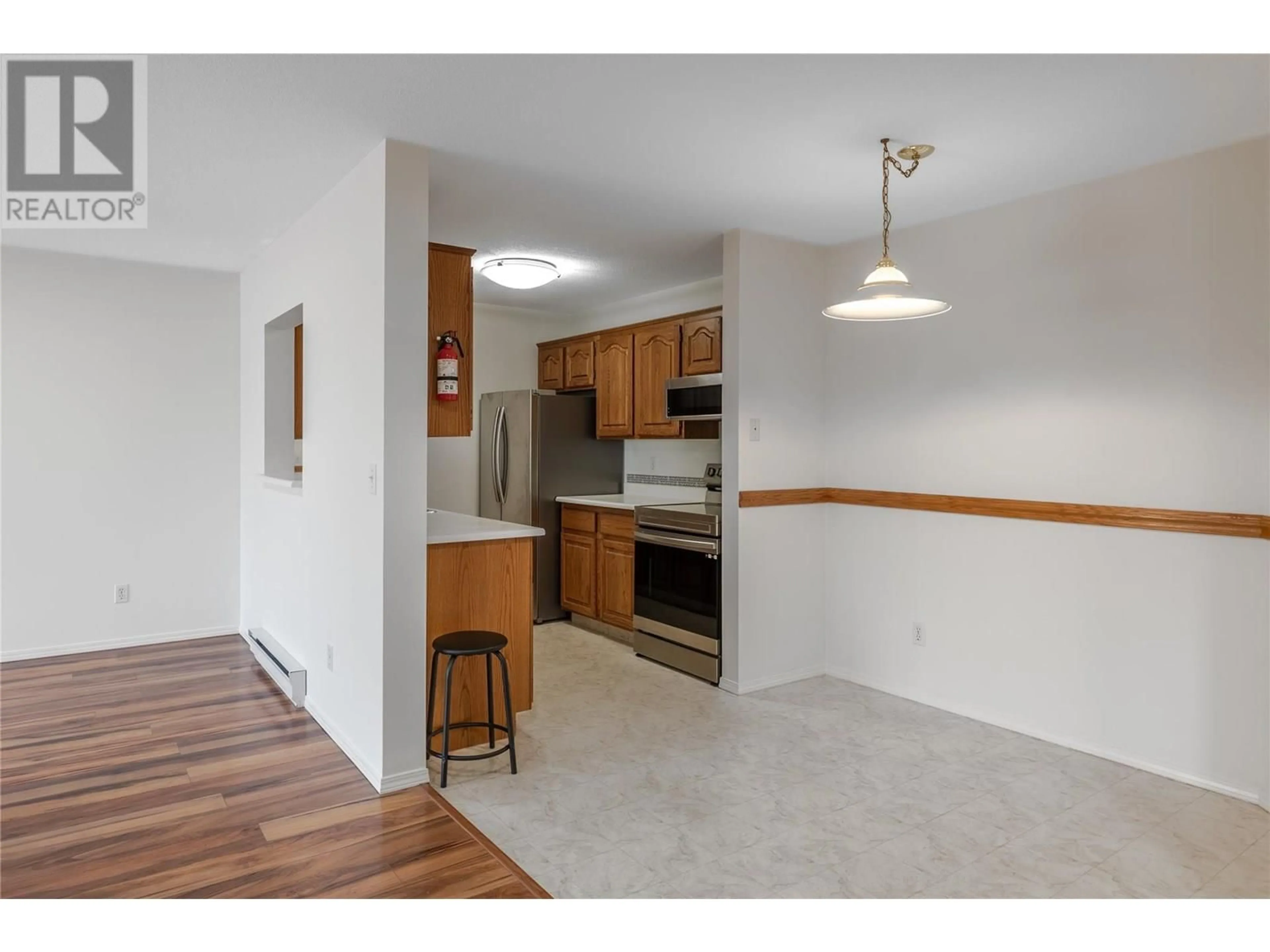 Standard kitchen, wood/laminate floor for 307 - 1329 KLO ROAD, Kelowna British Columbia V1W3N9