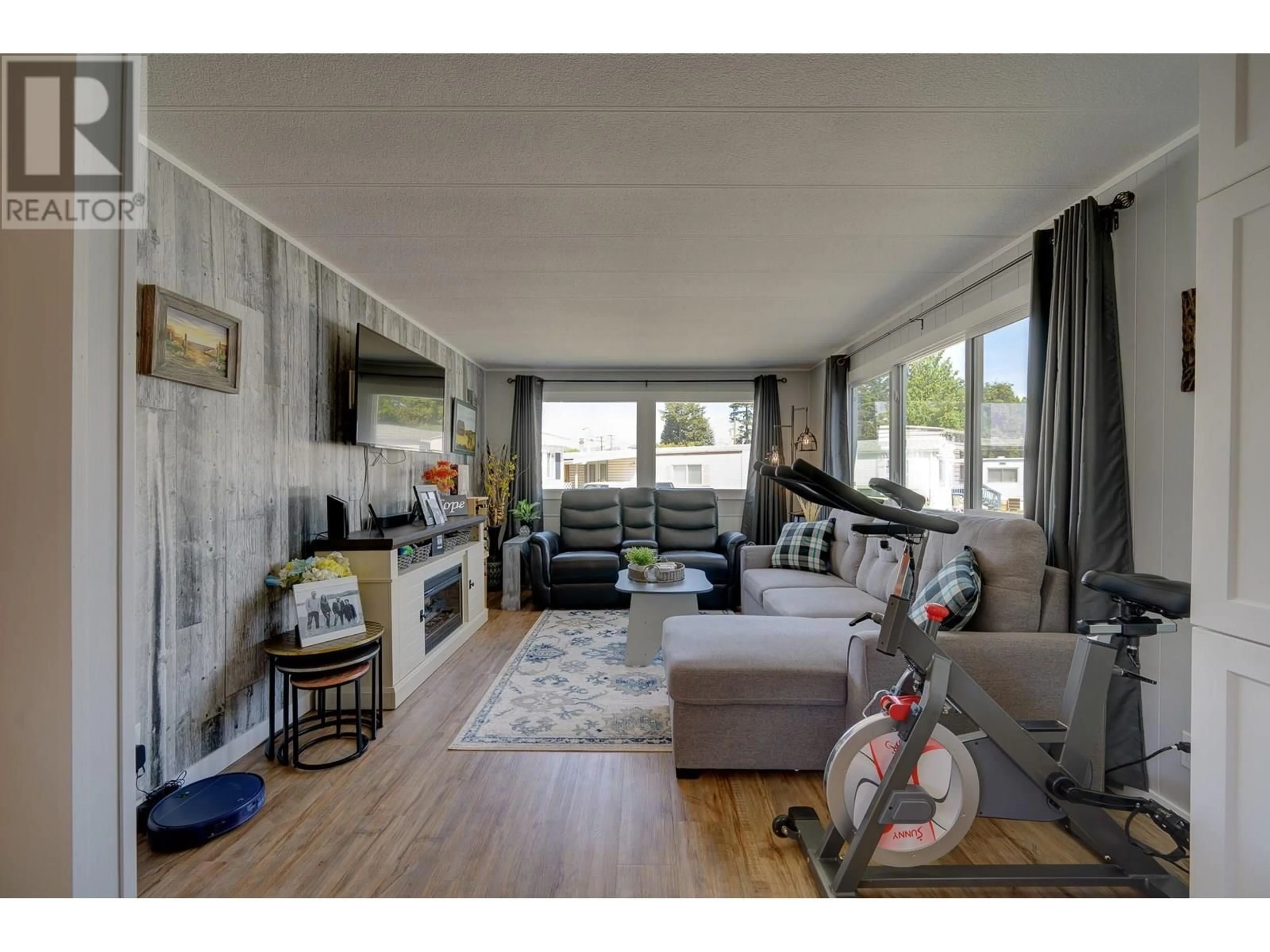 Living room with furniture, wood/laminate floor for 7 NEPTUNE DRIVE, Kamloops British Columbia V2B1A8