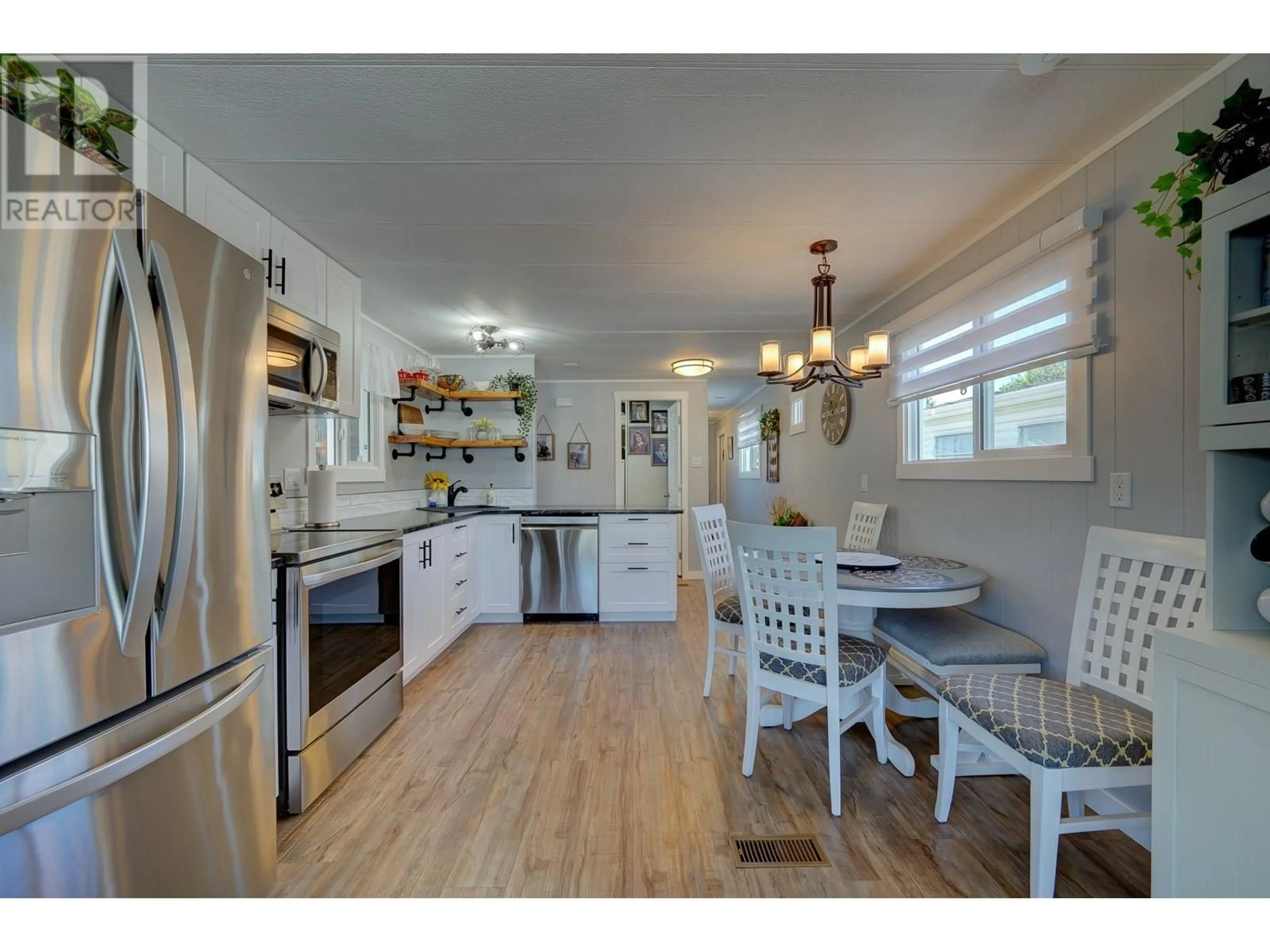 Open concept kitchen, wood/laminate floor for 7 NEPTUNE DRIVE, Kamloops British Columbia V2B1A8
