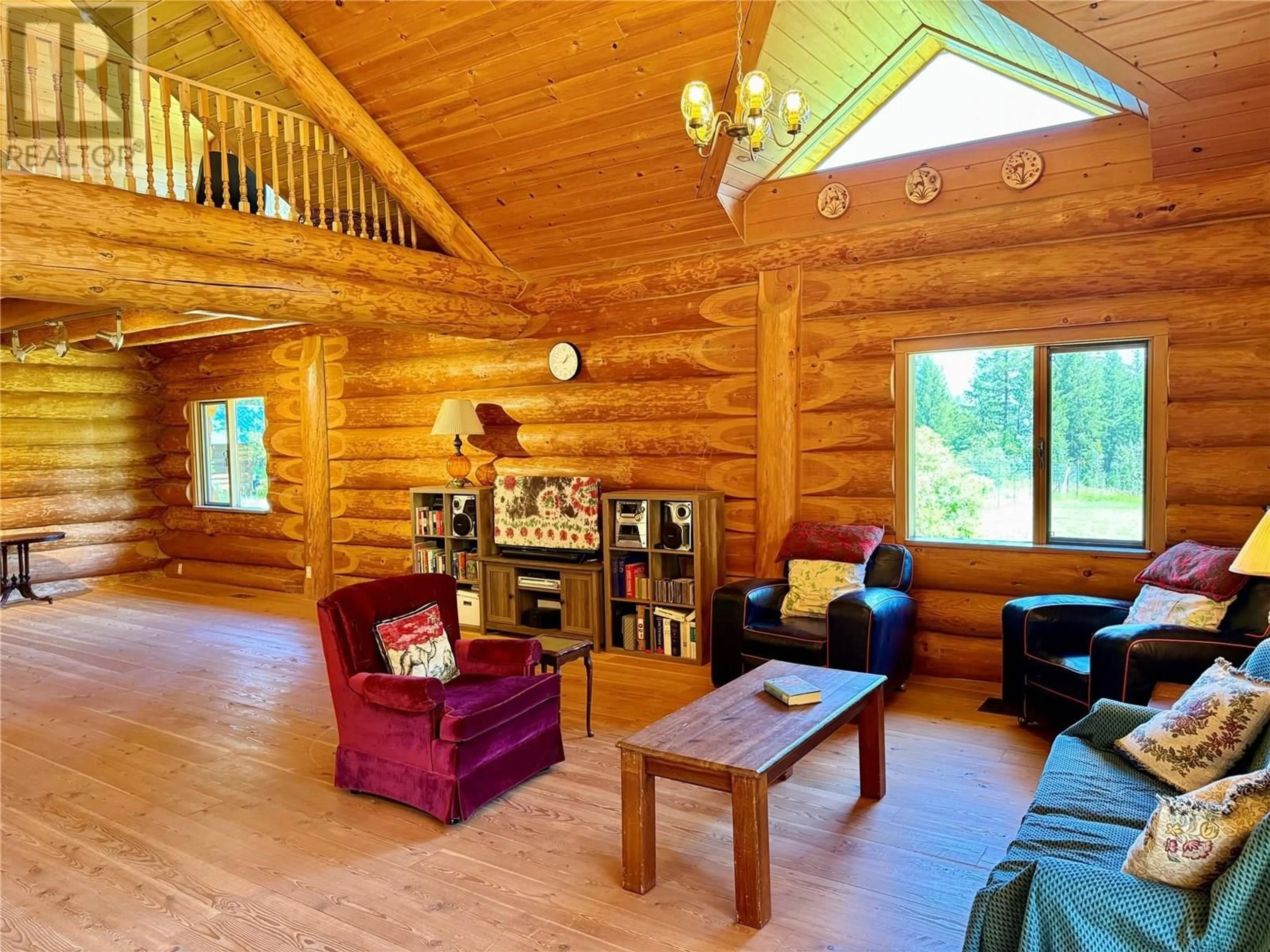 Living room with furniture, wood/laminate floor for 5200 HARDY MOUNTAIN ROAD, Grand Forks British Columbia V0H1H2