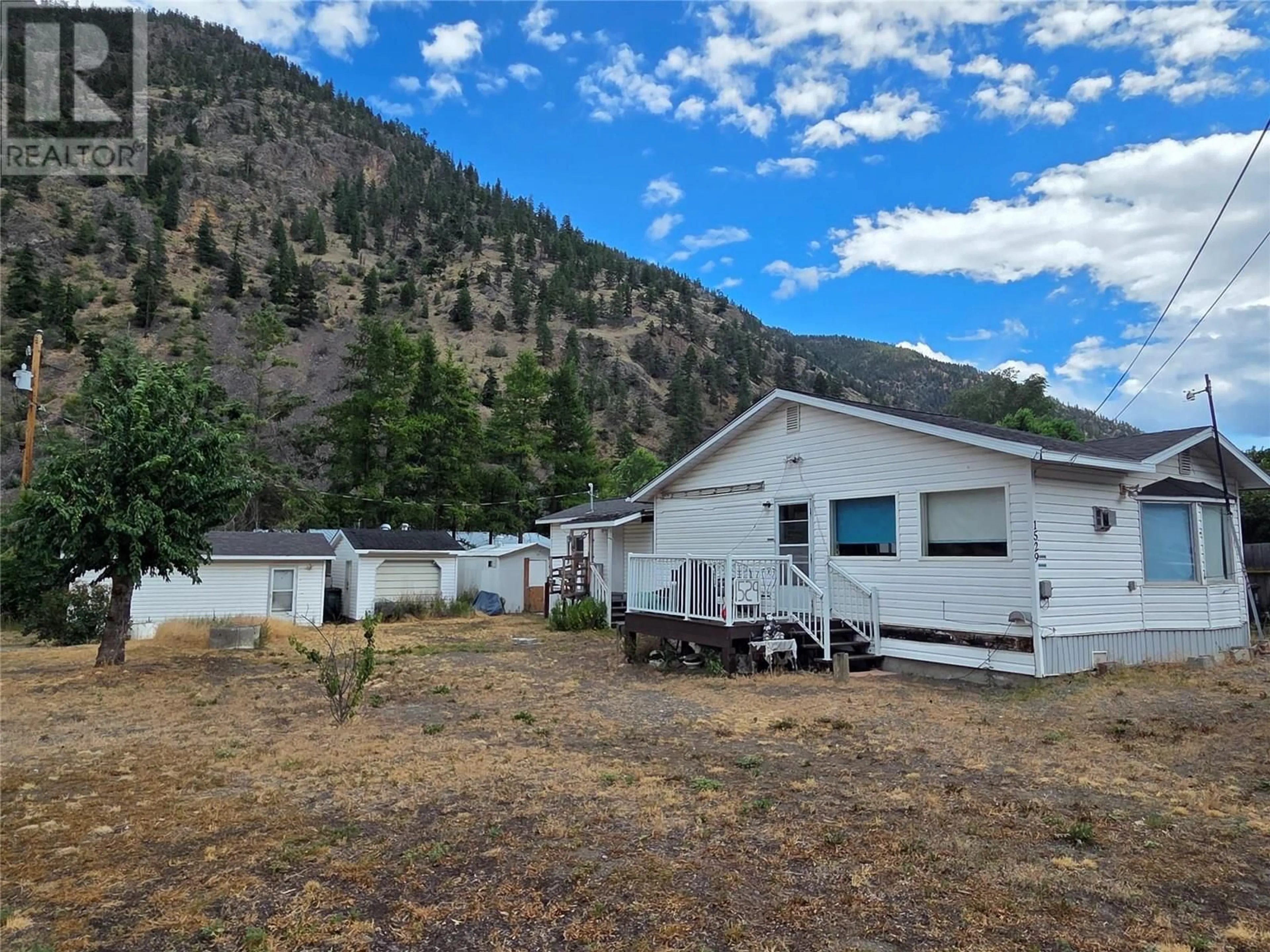 A pic from outside/outdoor area/front of a property/back of a property/a pic from drone, mountain view for 1529 MAIN STREET OTHER, Keremeos British Columbia V0X1N6