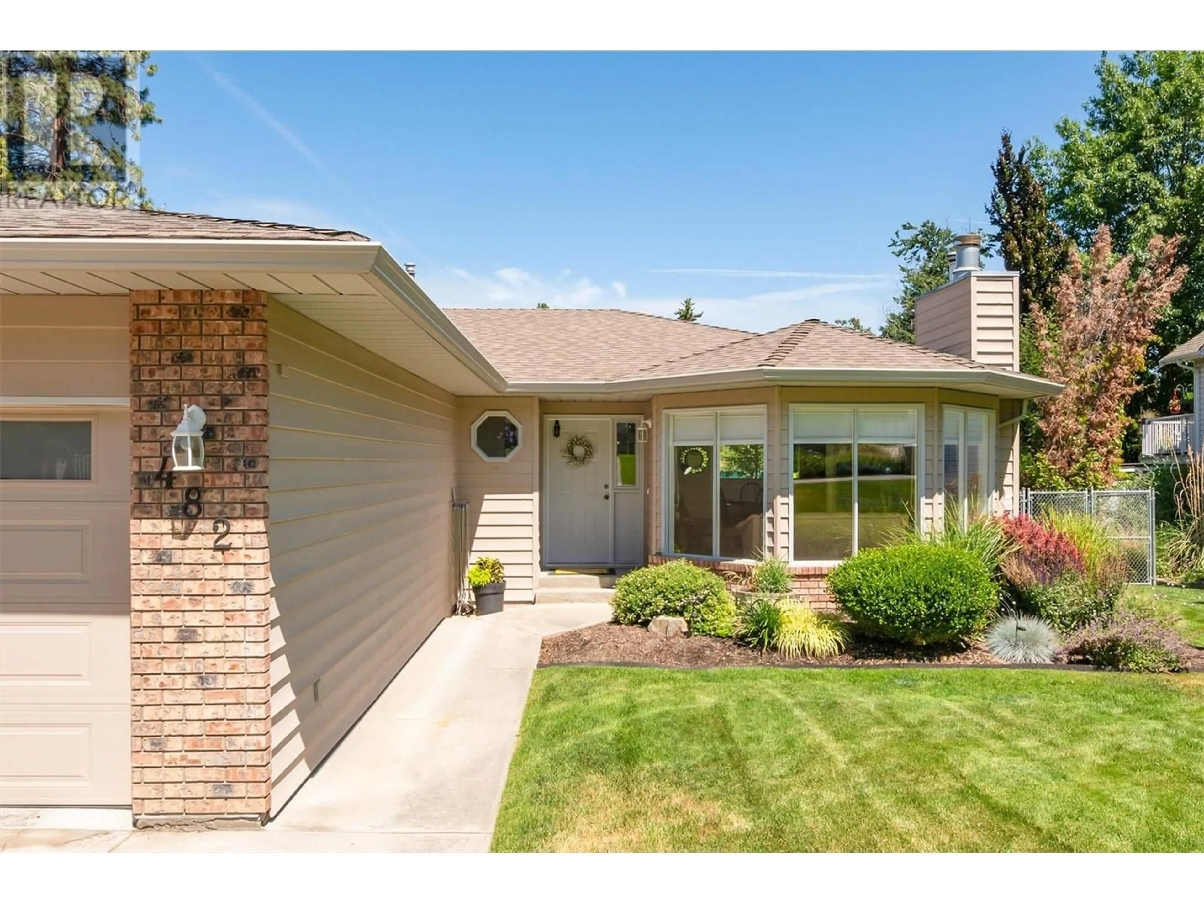 Home with brick exterior material, street for 482 CURLEW DRIVE, Kelowna British Columbia V1W4L1