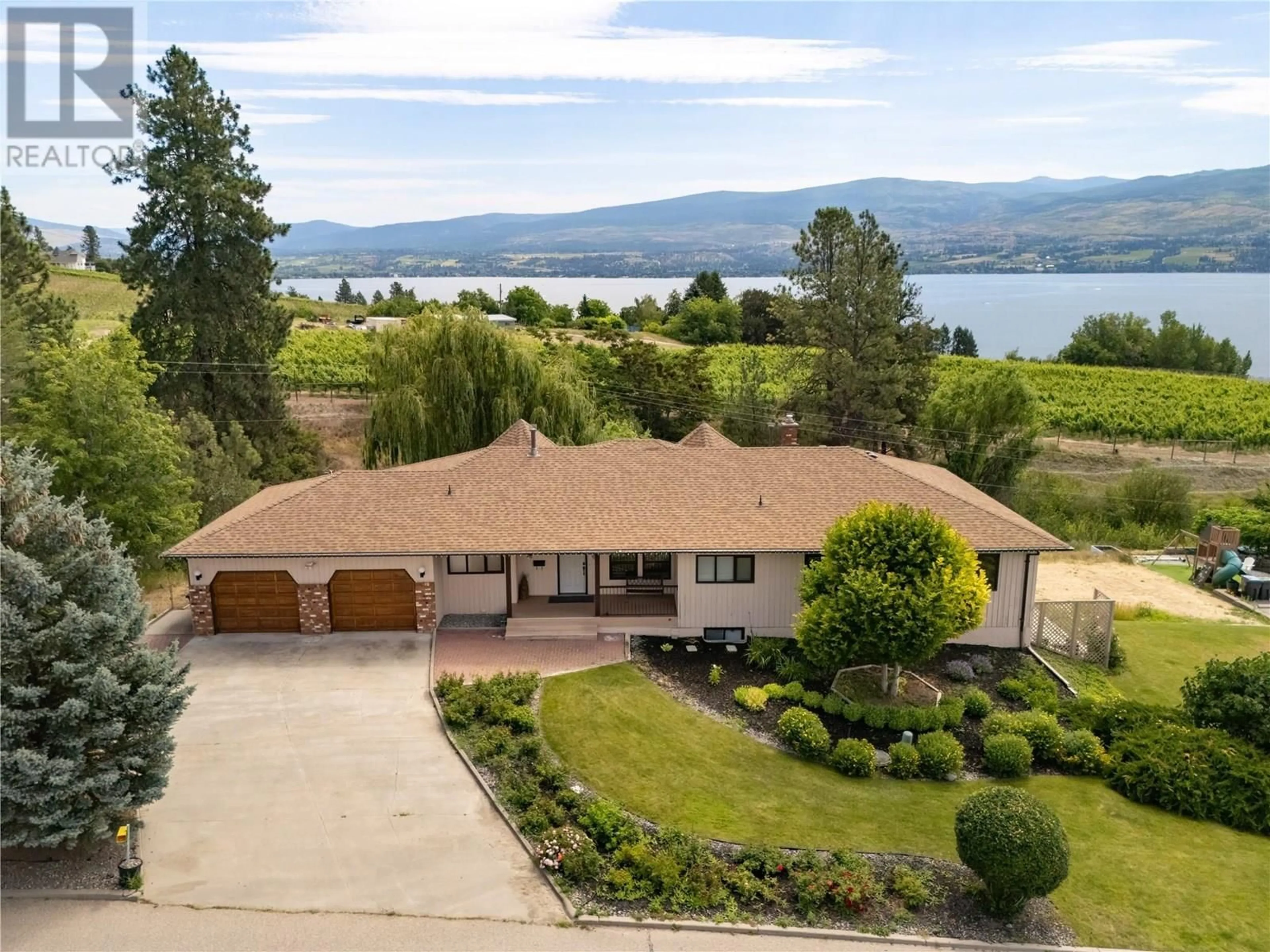 A pic from outside/outdoor area/front of a property/back of a property/a pic from drone, water/lake/river/ocean view for 1049 KELLY DRIVE, West Kelowna British Columbia V1Z2T1