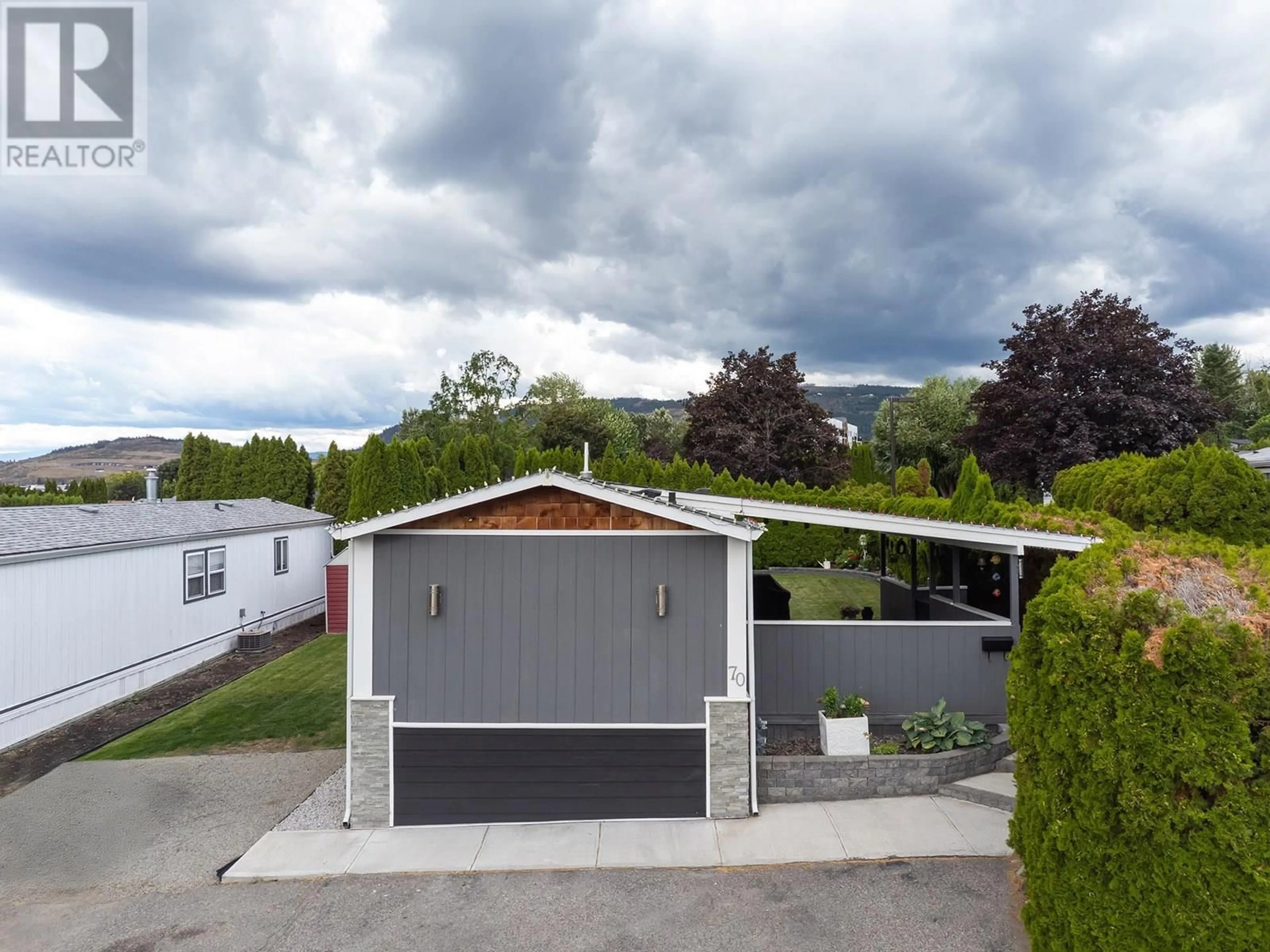 A pic from outside/outdoor area/front of a property/back of a property/a pic from drone, street for 70 - 3381 VILLAGE GREEN WAY, Westbank British Columbia V4T1L2