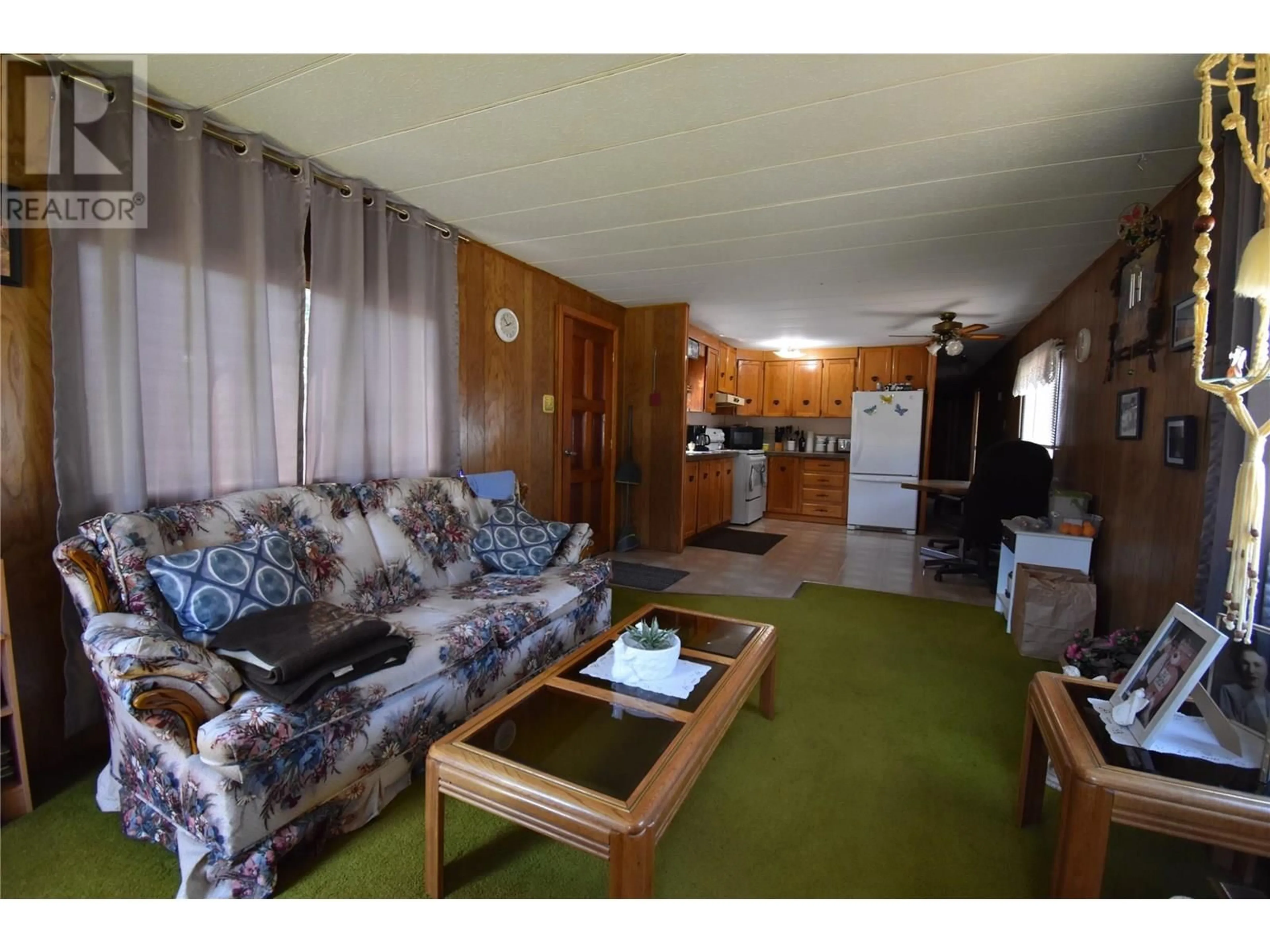 Living room with furniture, wood/laminate floor for 159 SCHULTE CRESCENT, Castlegar British Columbia V1N3E1