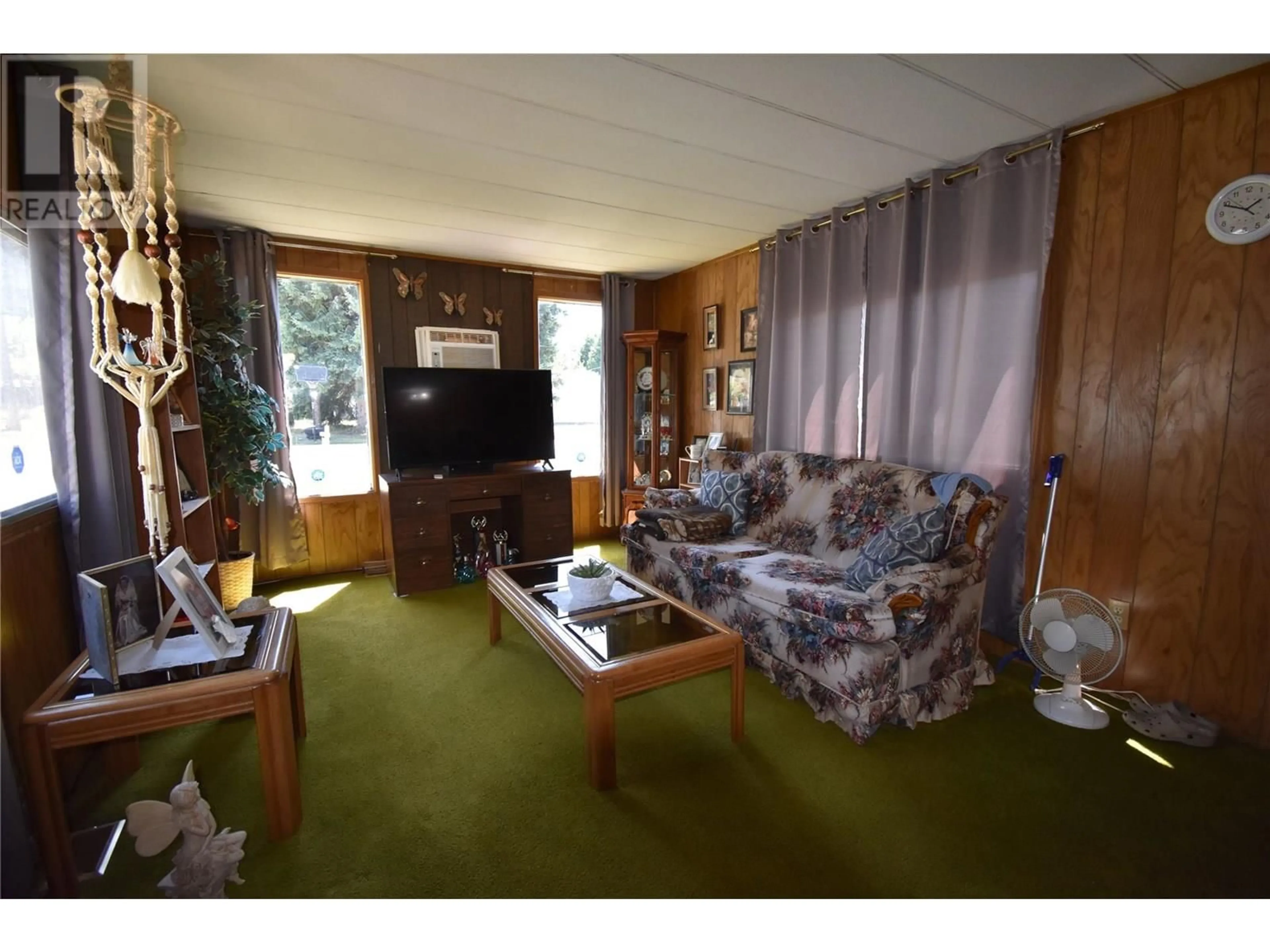 Living room with furniture, wood/laminate floor for 159 SCHULTE CRESCENT, Castlegar British Columbia V1N3E1