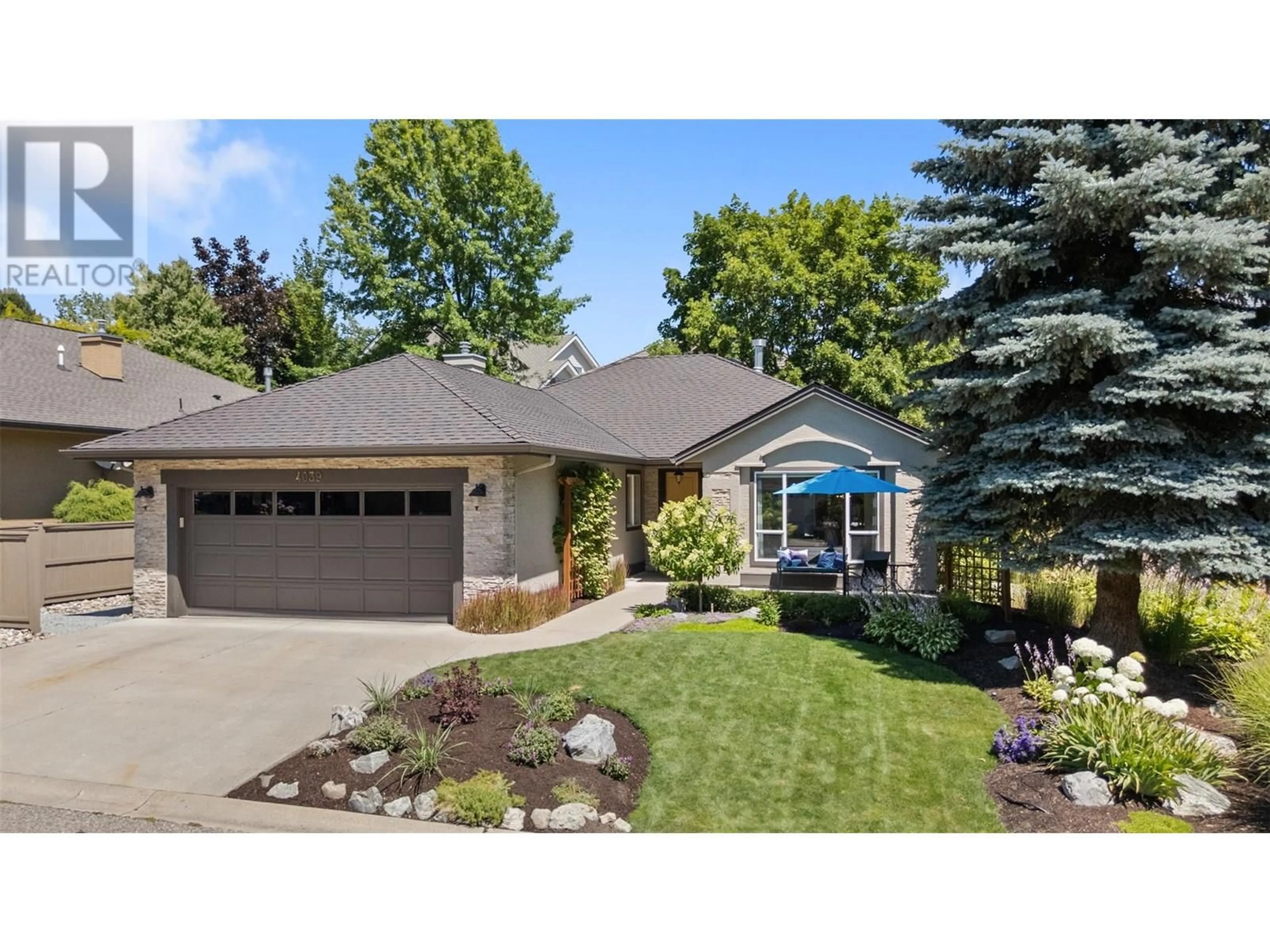 Home with vinyl exterior material, street for 4039 GALLAGHERS TERRACE, Kelowna British Columbia V1W3Z8