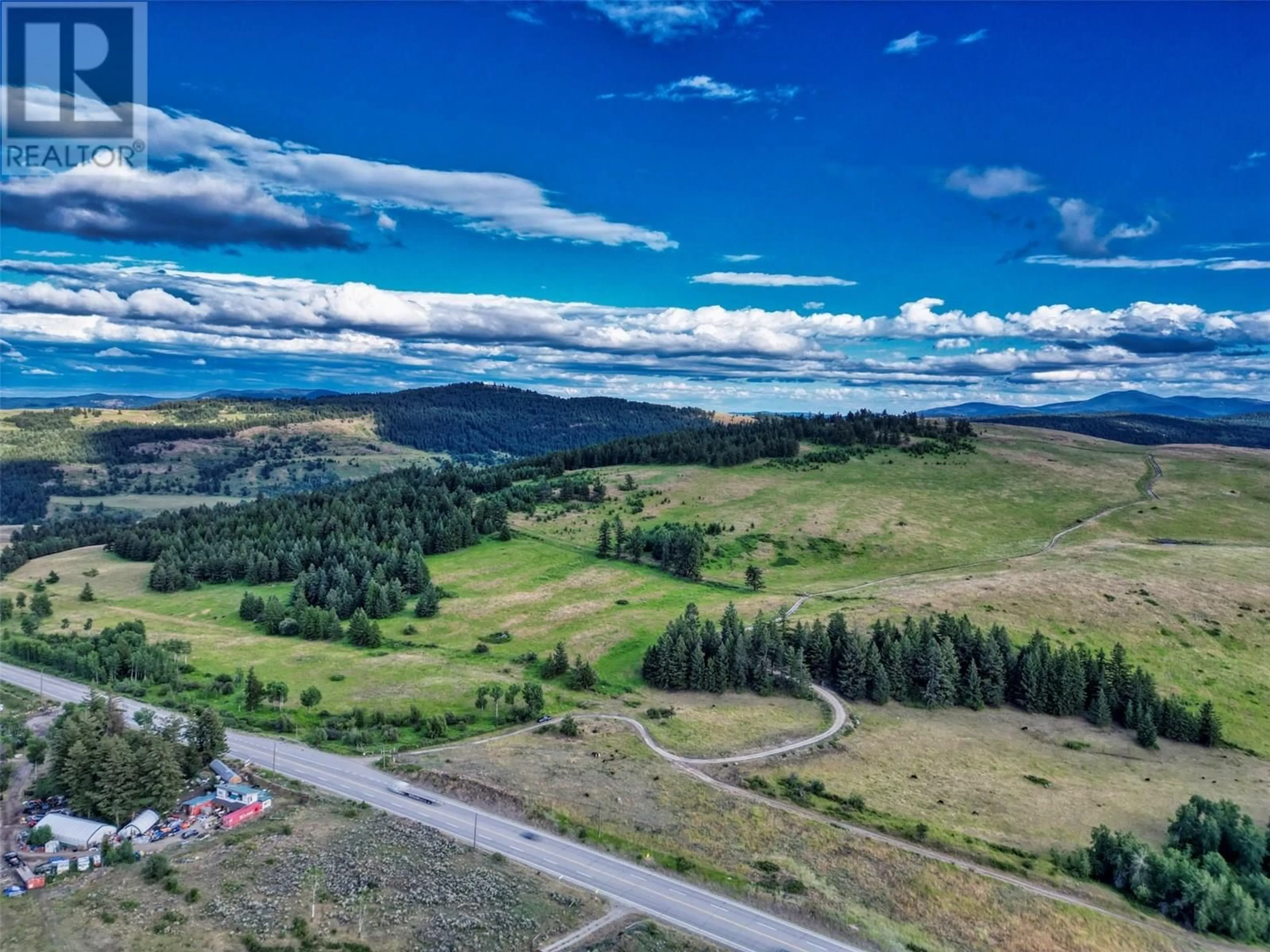 A pic from outside/outdoor area/front of a property/back of a property/a pic from drone, mountain view for 6080 HIGHWAY 3 OTHER, Bridesville British Columbia V0H1Y0