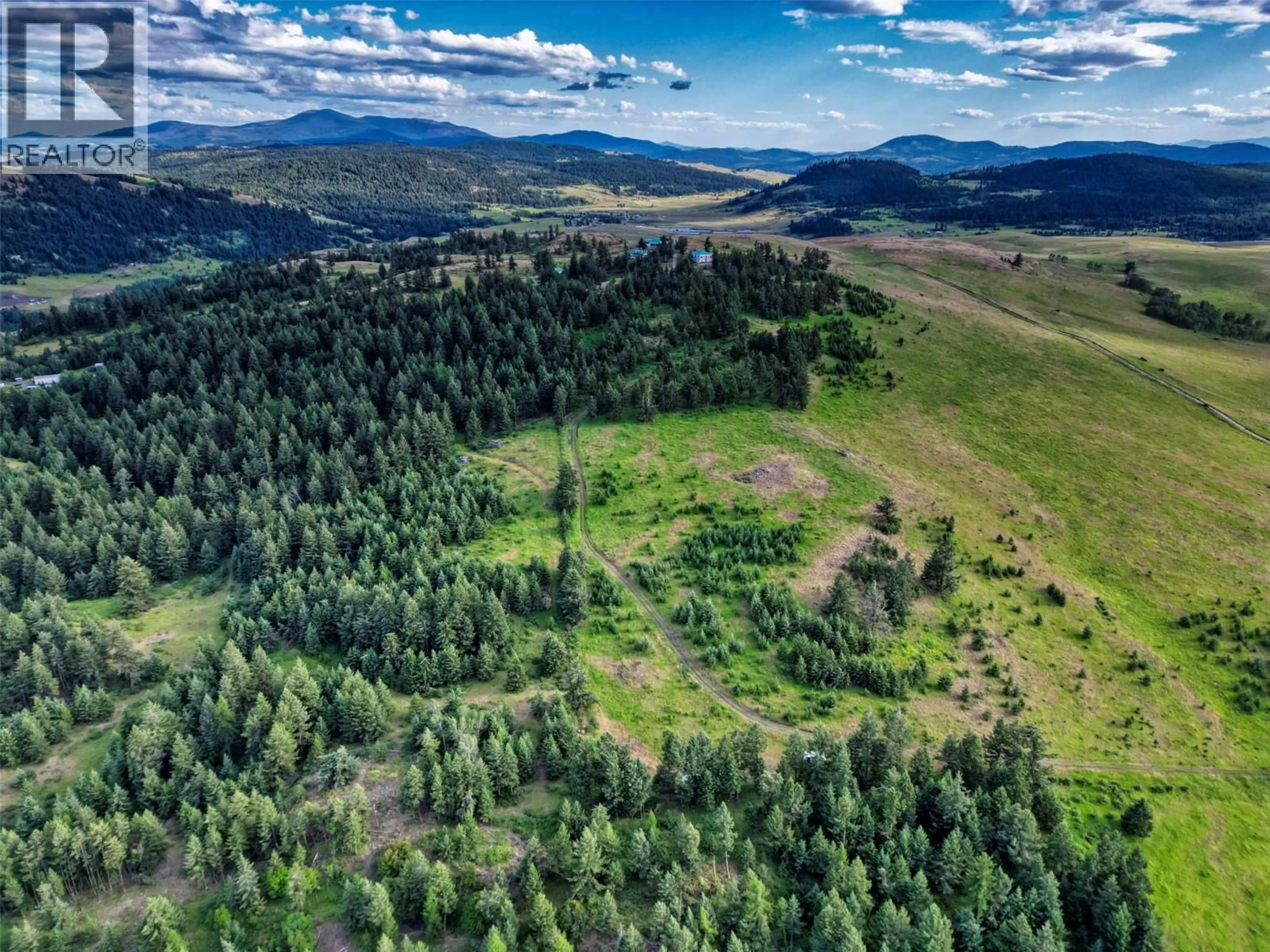 A pic from outside/outdoor area/front of a property/back of a property/a pic from drone, forest/trees view for 6080 HIGHWAY 3 OTHER, Bridesville British Columbia V0H1Y0