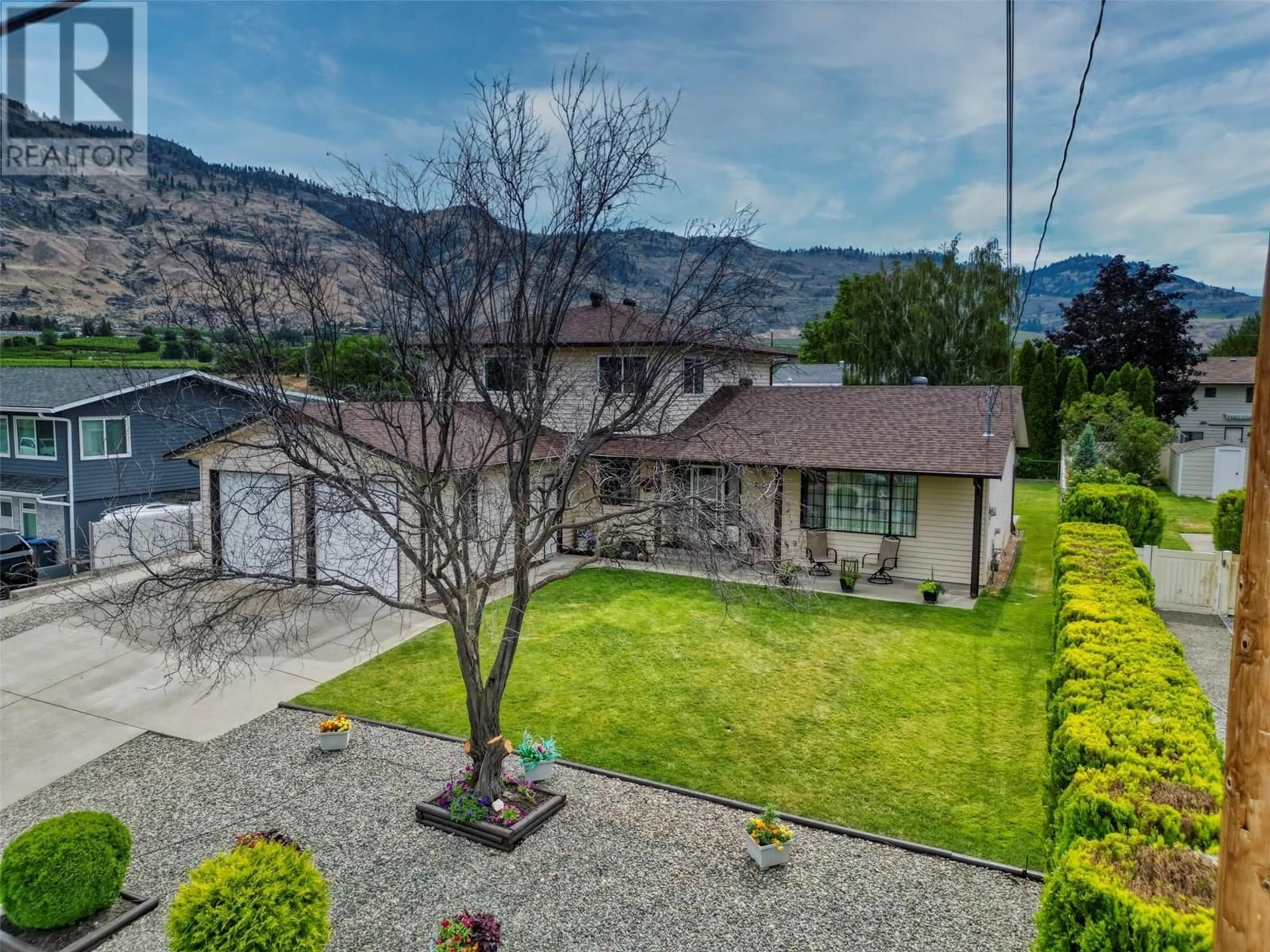 A pic from outside/outdoor area/front of a property/back of a property/a pic from drone, mountain view for 7227 COTTONWOOD DRIVE, Osoyoos British Columbia V0H1V3
