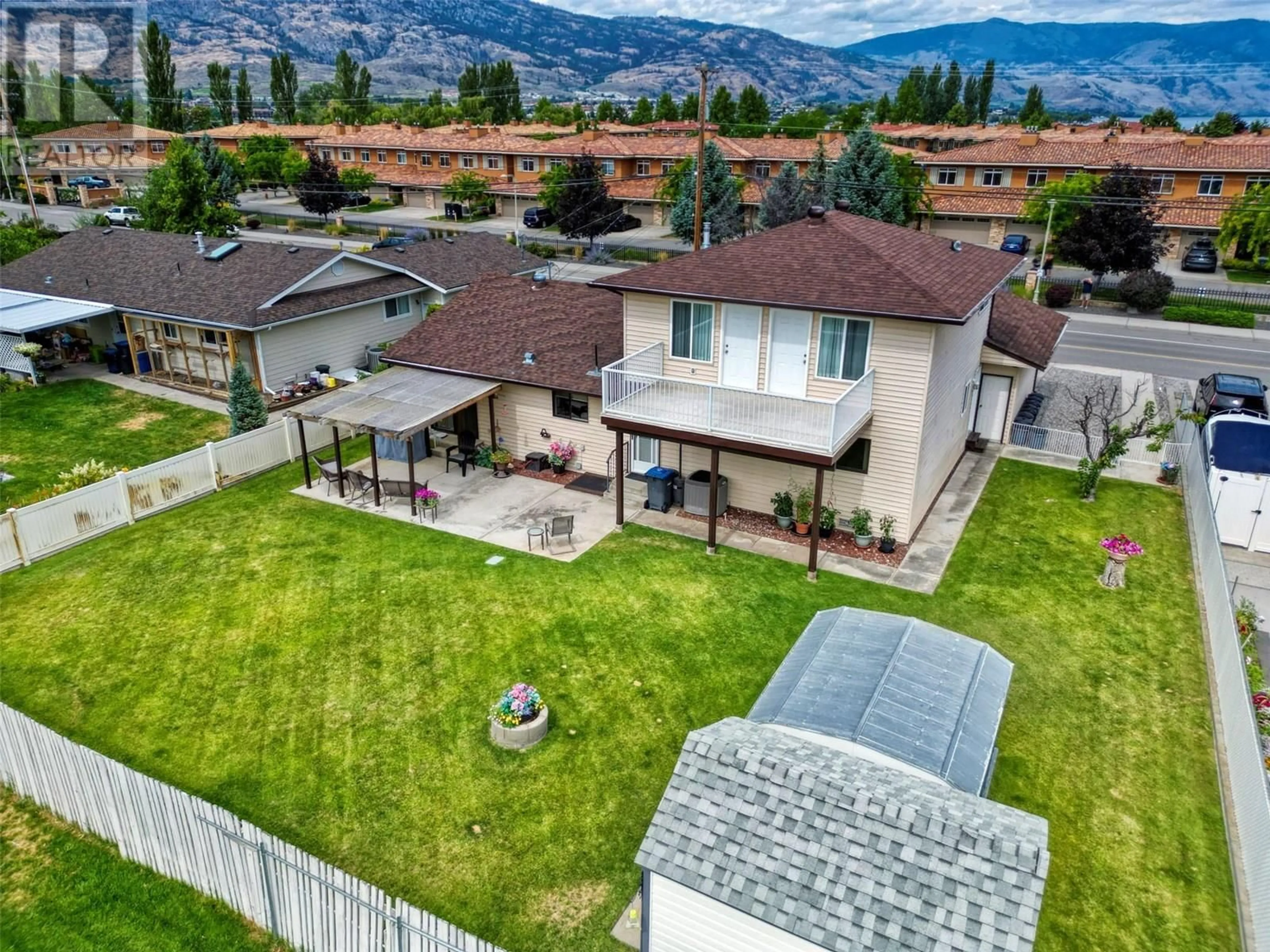 A pic from outside/outdoor area/front of a property/back of a property/a pic from drone, mountain view for 7227 COTTONWOOD DRIVE, Osoyoos British Columbia V0H1V3