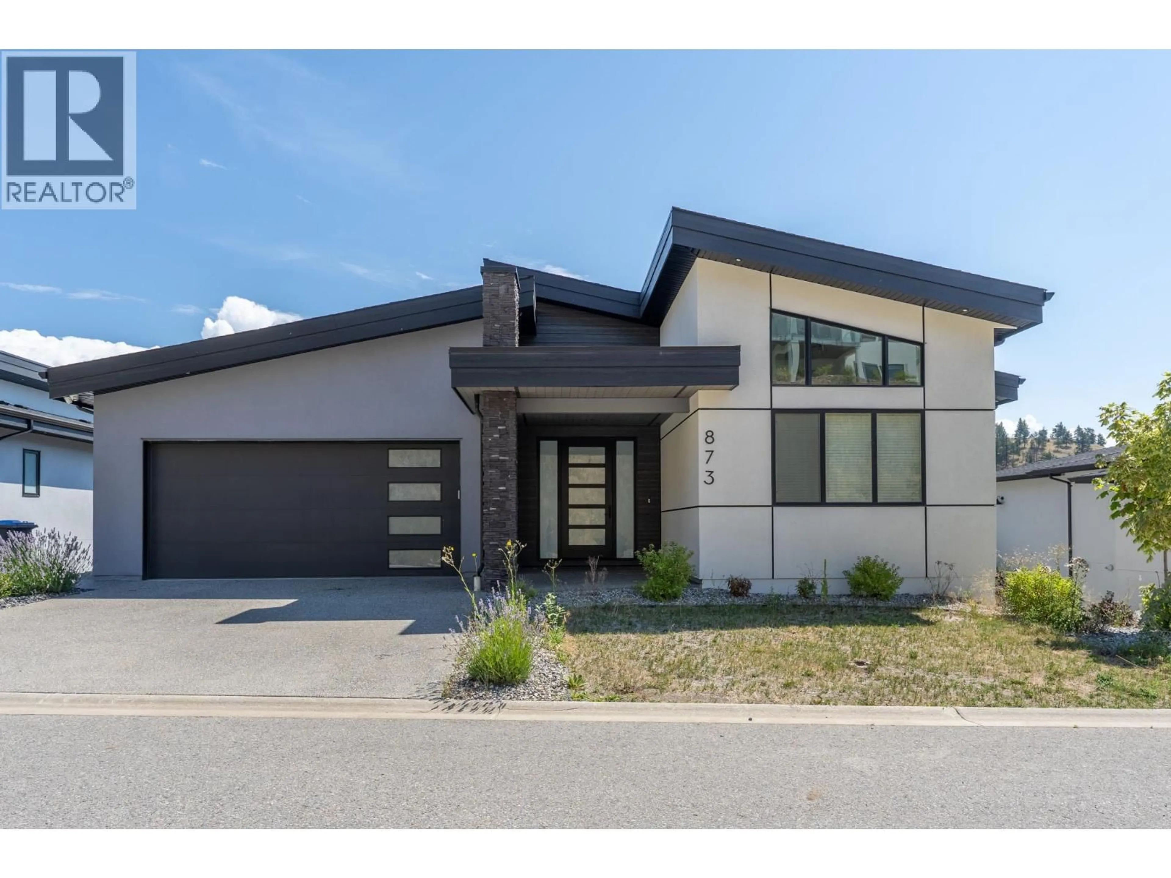 Home with brick exterior material, street for 873 ROYAL TROON LANE, Kelowna British Columbia V1P0A3