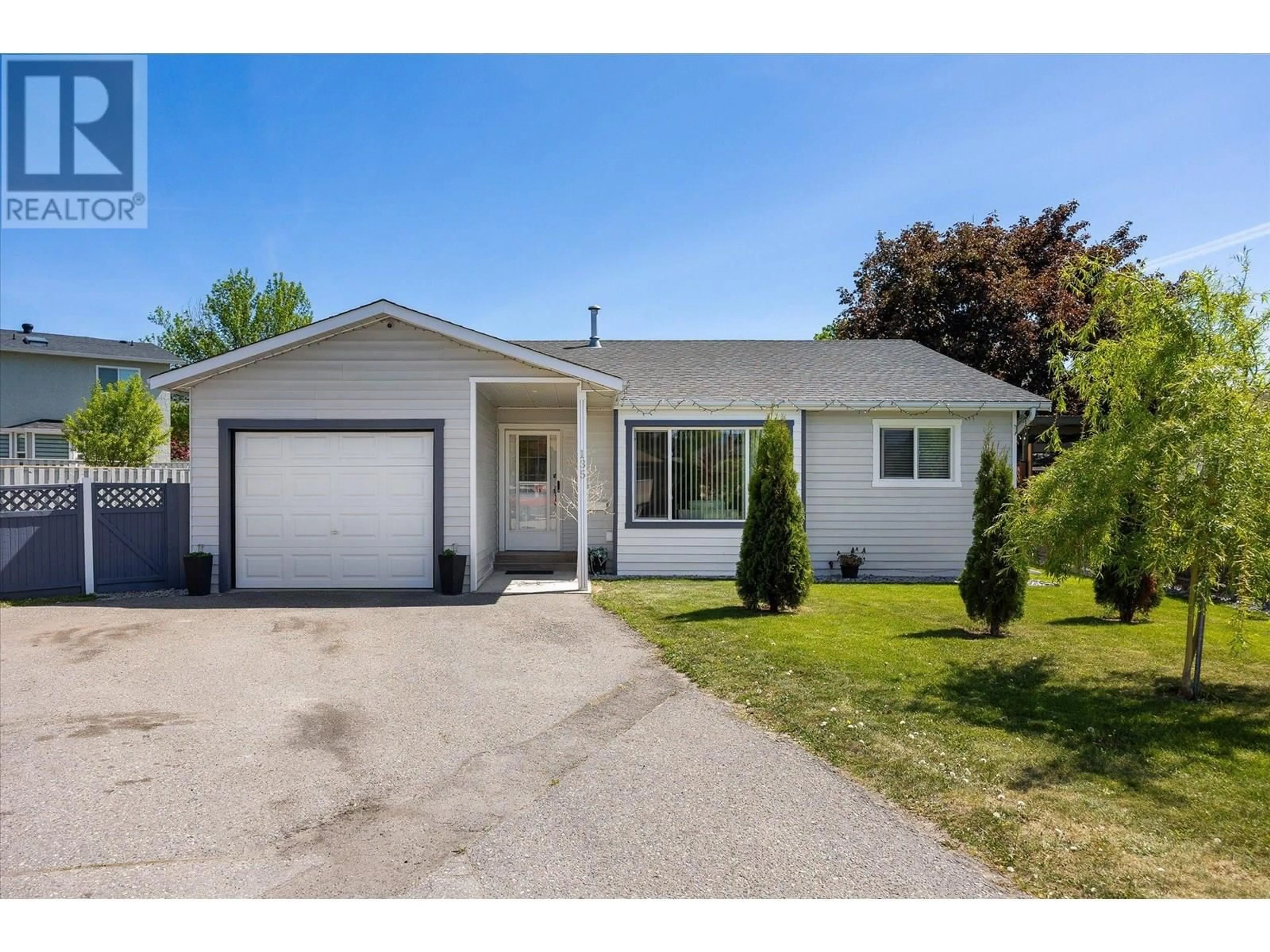Home with vinyl exterior material, street for 135 ALMOND COURT, Kelowna British Columbia V1X6H1