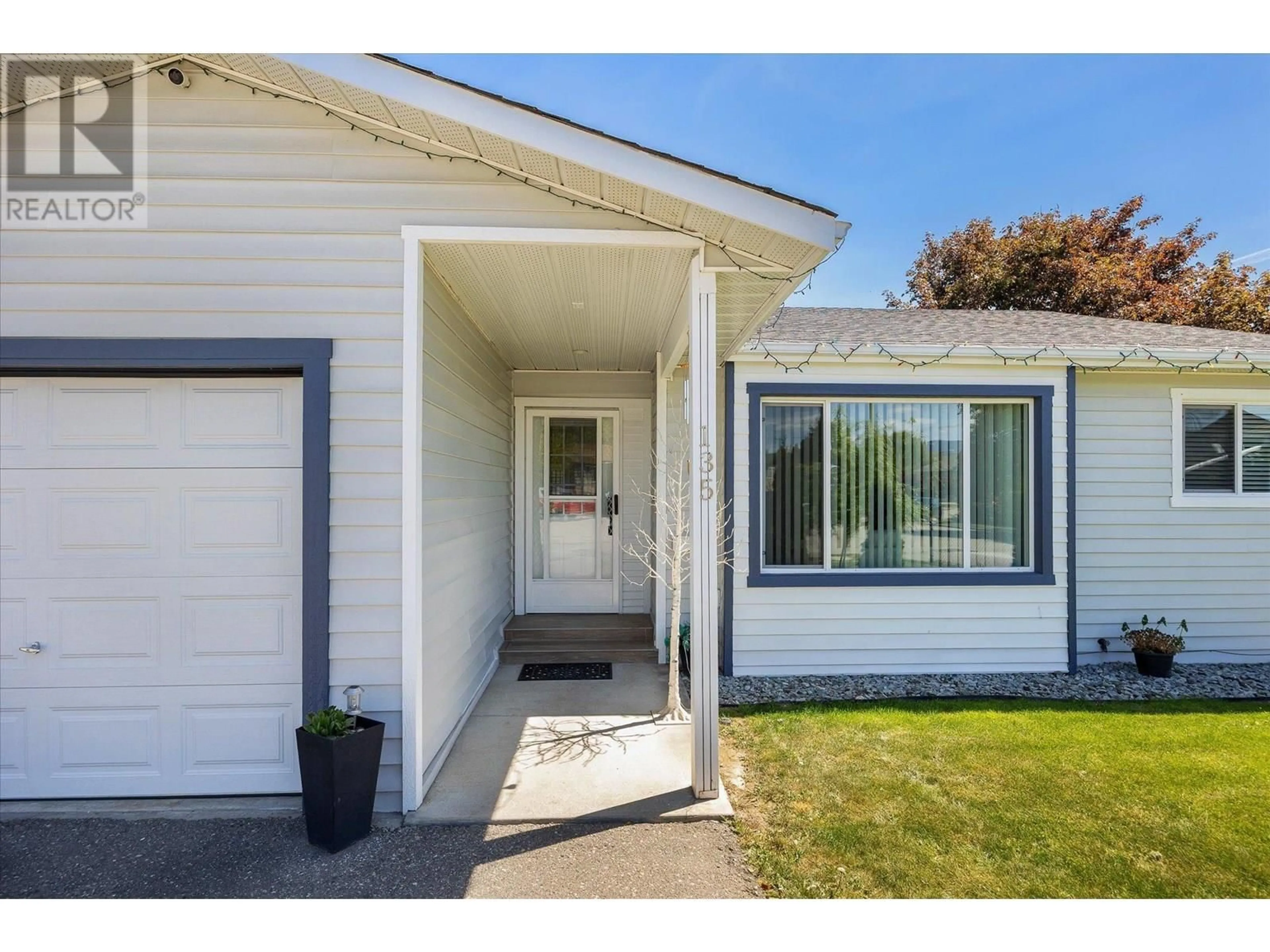 Home with vinyl exterior material, street for 135 ALMOND COURT, Kelowna British Columbia V1X6H1