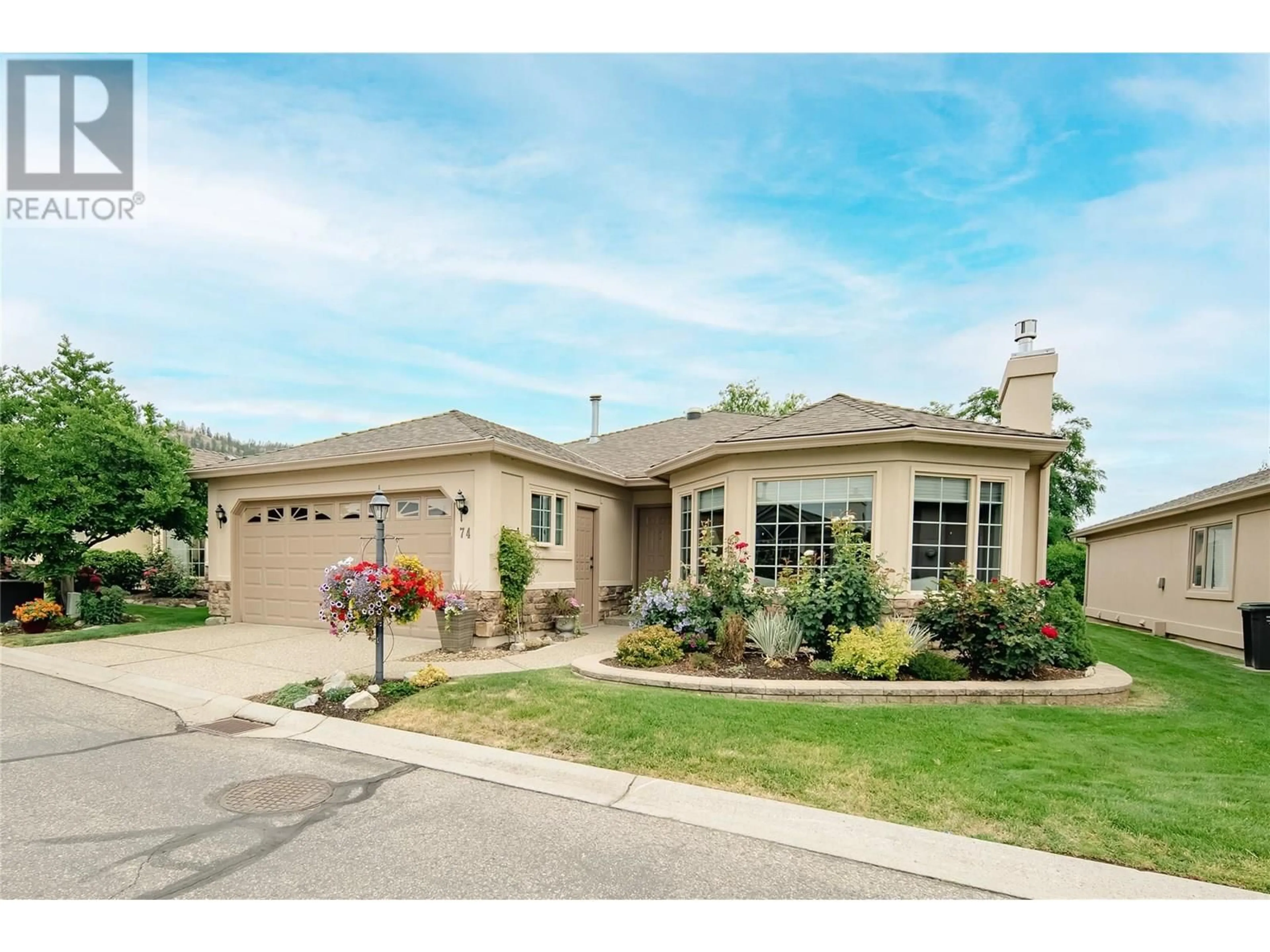 Home with vinyl exterior material, street for 74 - 595 YATES ROAD, Kelowna British Columbia V1V1P8