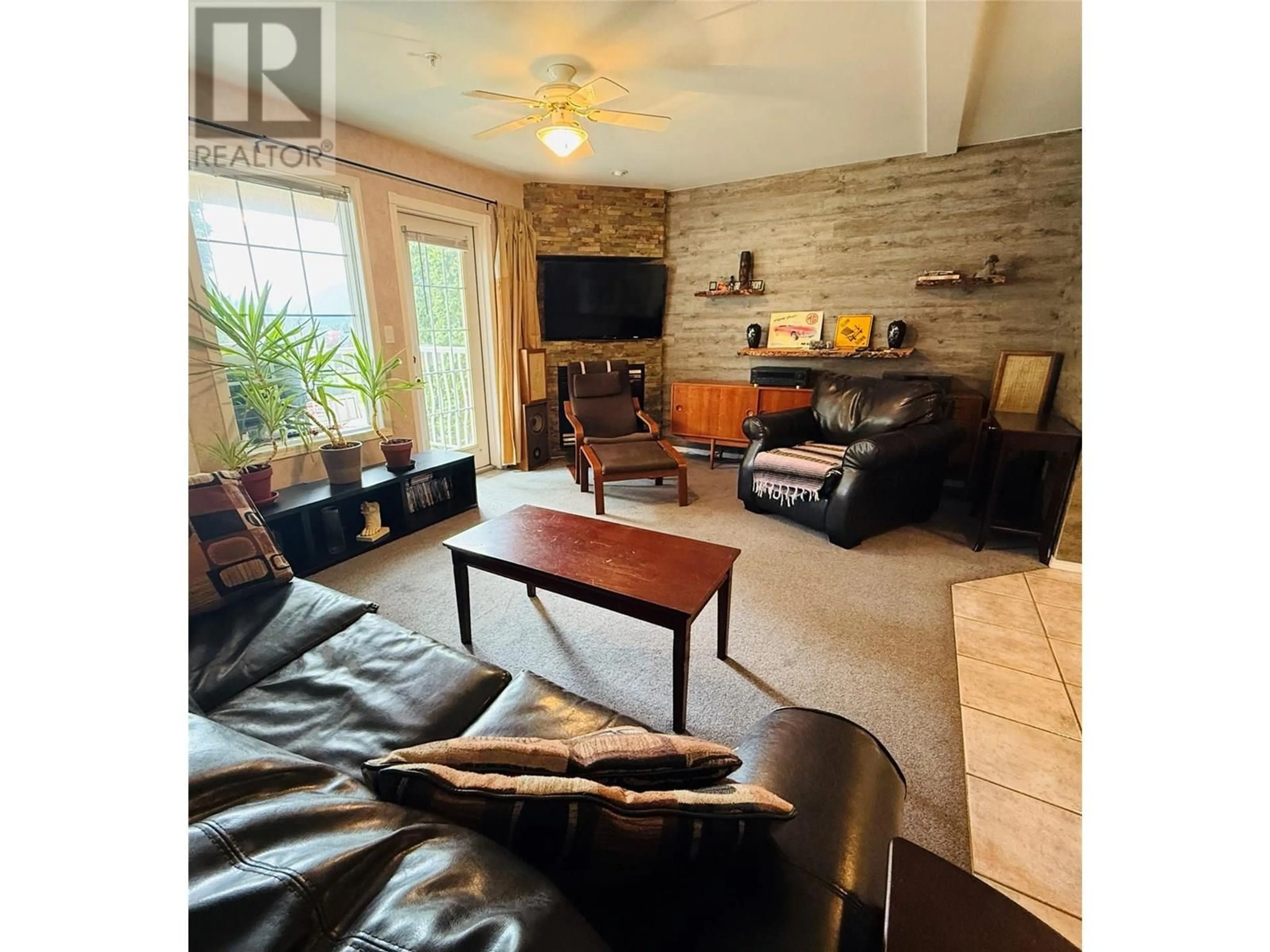 Living room with furniture, wood/laminate floor for 3005B - 5052 RIVERVIEW ROAD, Fairmont Hot Springs British Columbia V0B1L1