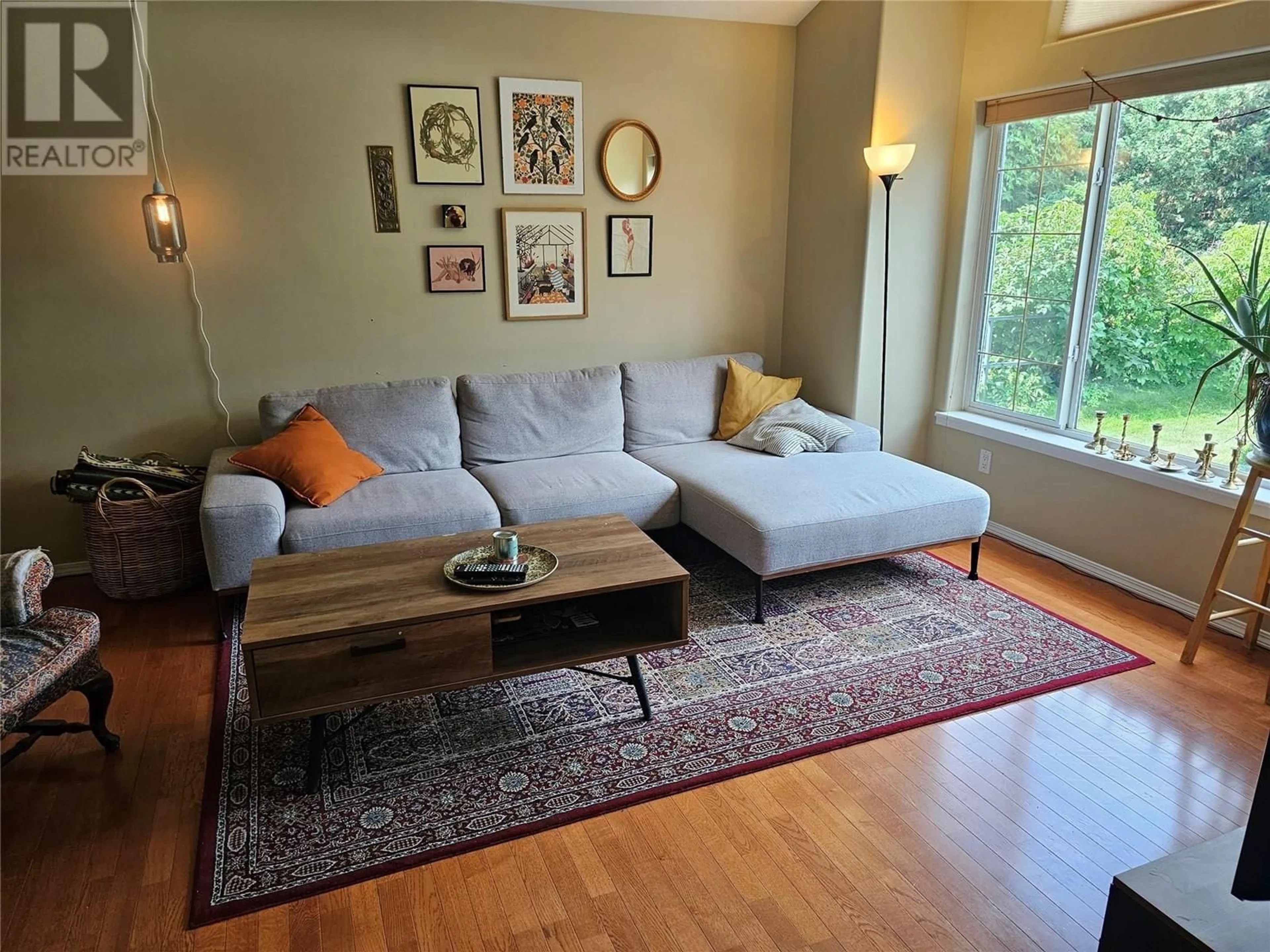 Living room with furniture, wood/laminate floor for 410 FIFTH STREET, Nelson British Columbia V1L2W7