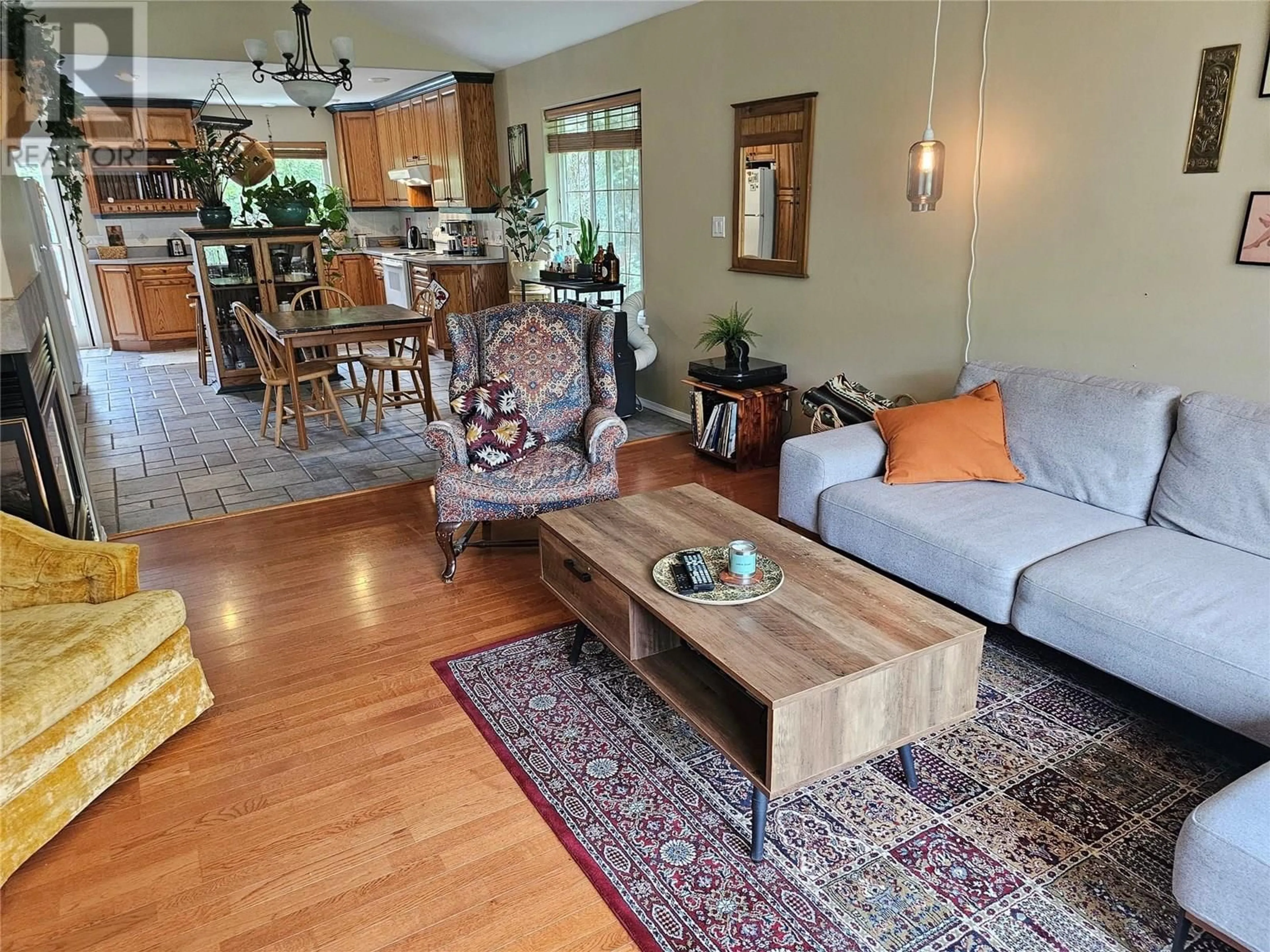 Living room with furniture, wood/laminate floor for 410 FIFTH STREET, Nelson British Columbia V1L2W7