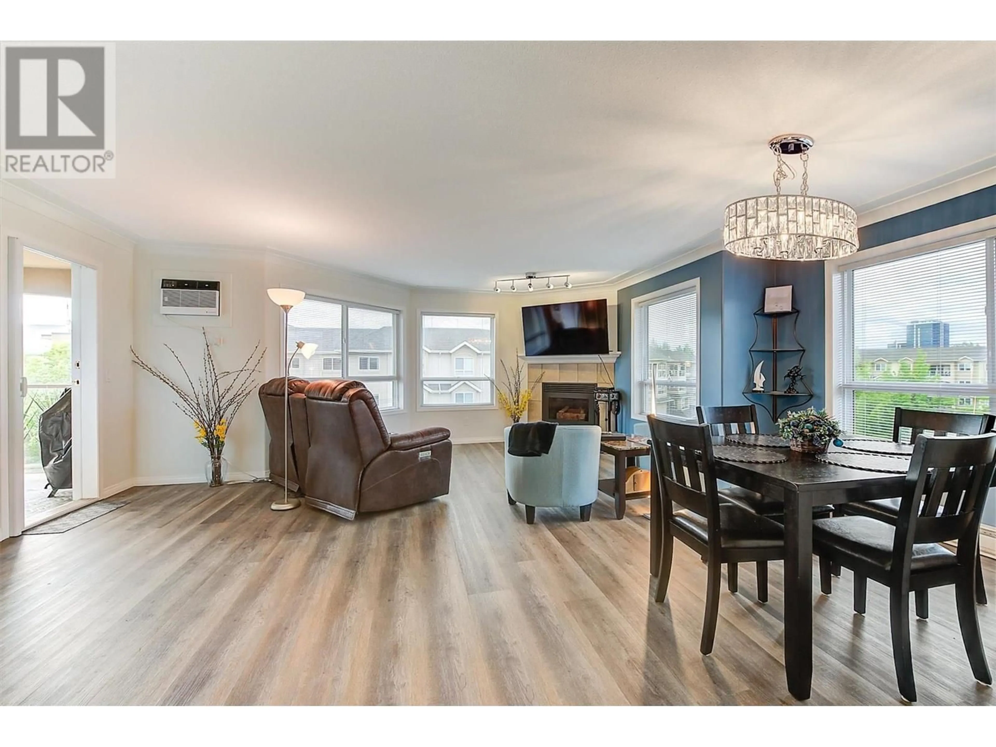 Open concept kitchen, wood/laminate floor for 413 - 1964 ENTERPRISE WAY, Kelowna British Columbia V1Y9S7